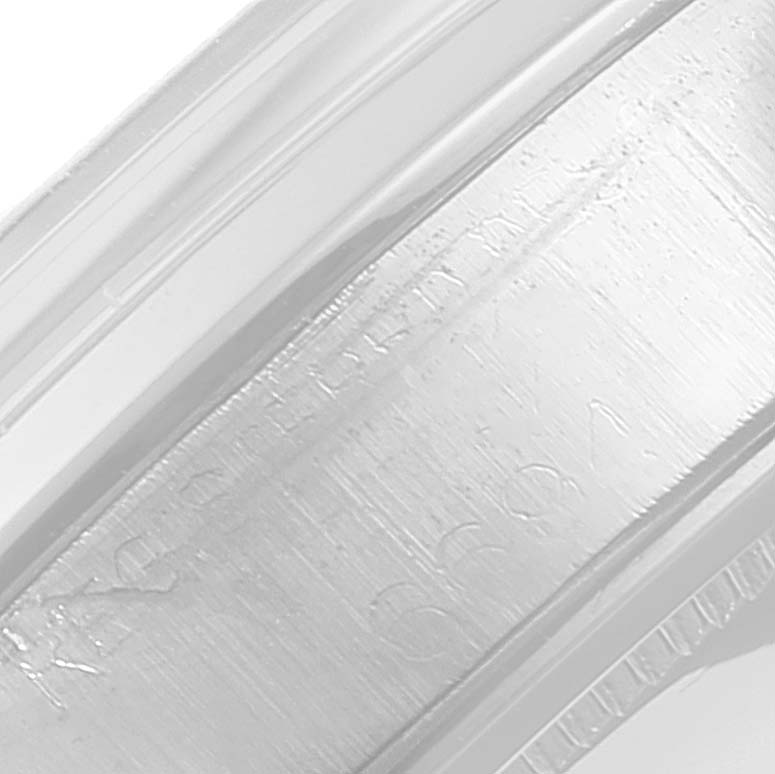 This image shows a close-up of the bezel and part of the case of the Vintage Collection model by Rolex.