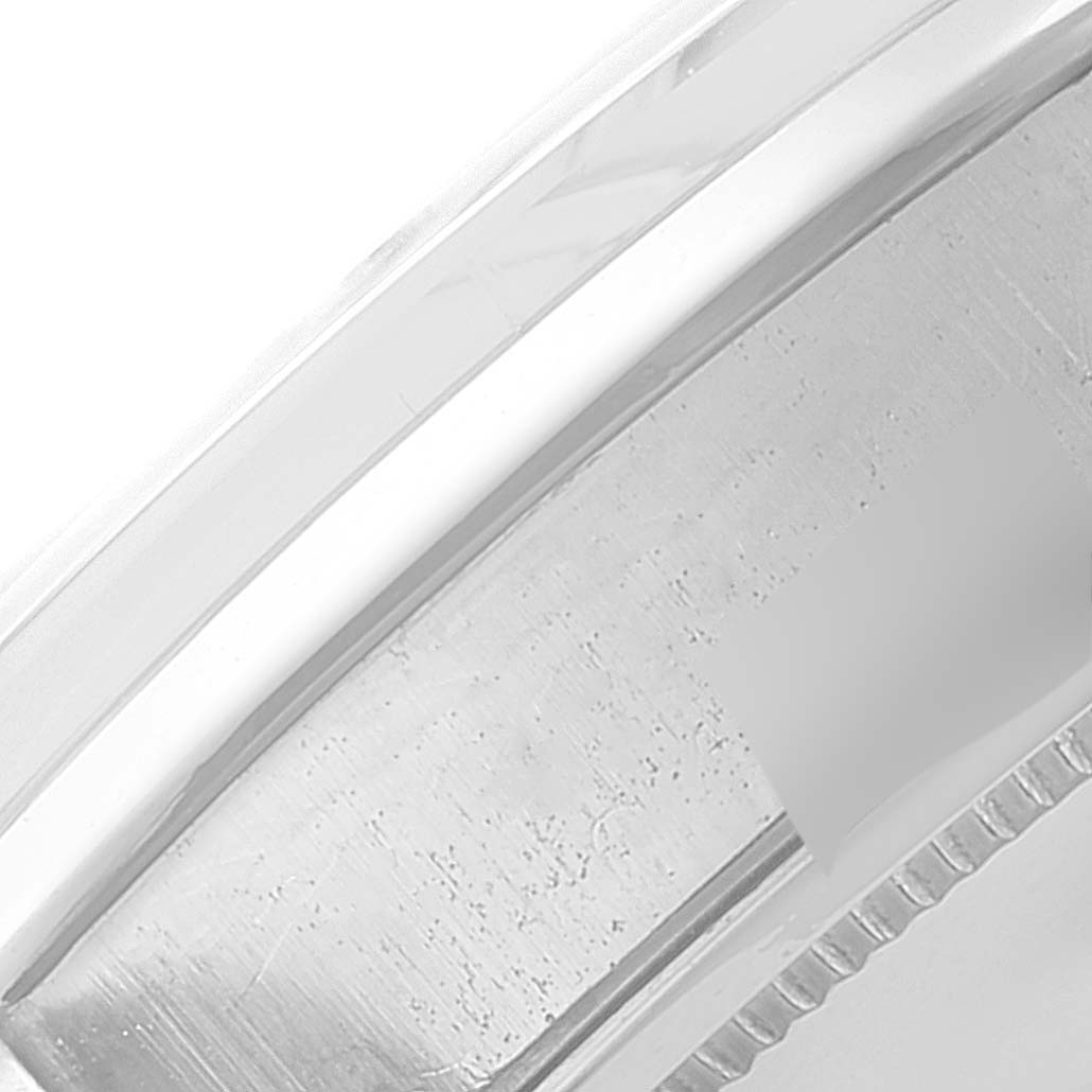 The image shows a close-up view of the edge of the case and crystal of a Vintage Collection model by Rolex.