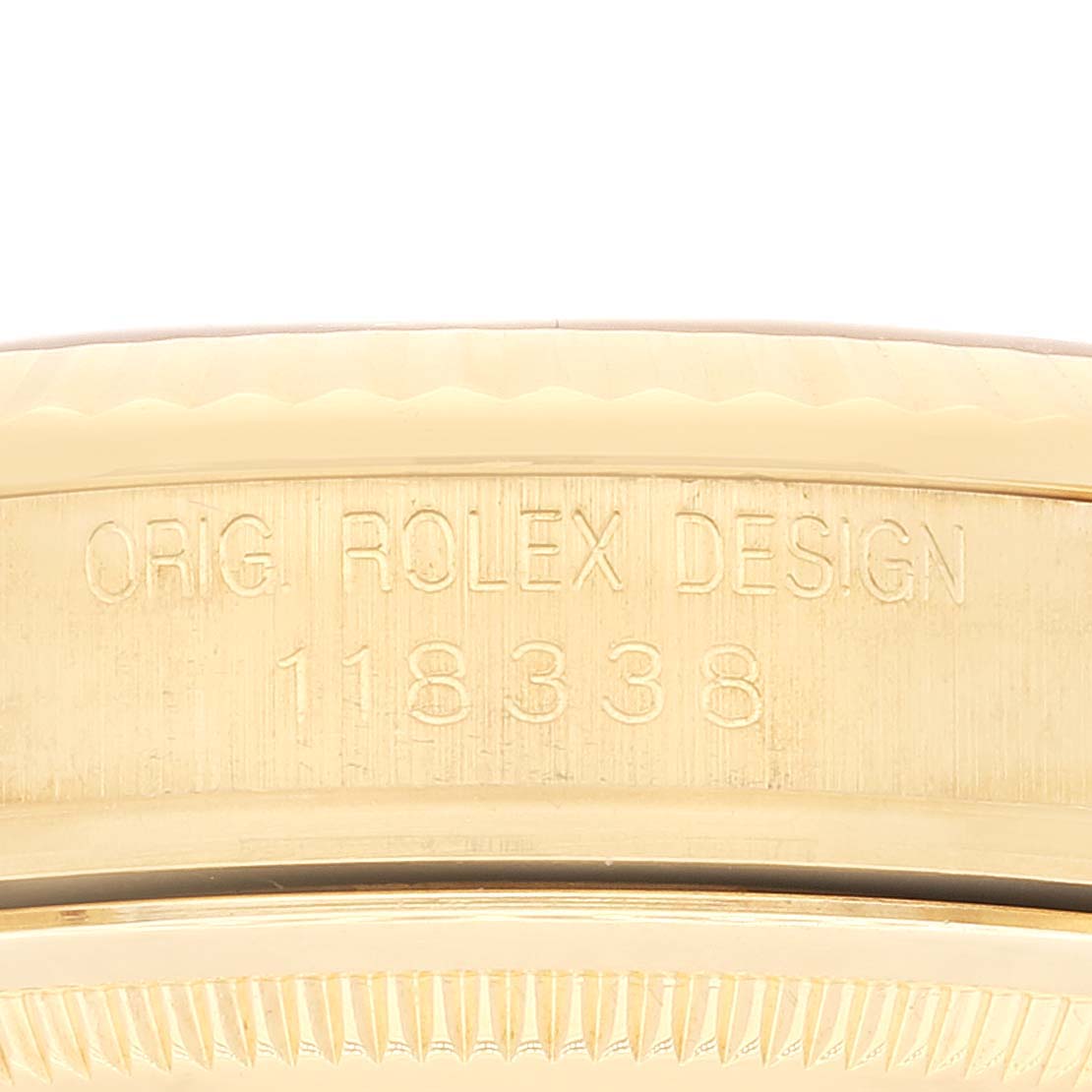This image shows a close-up of the engraved case back of a Rolex President 118338 Men
s Yellow Gold Champagne Dial 118338 Men
s Yellow Gold Champagne Dial model watch.