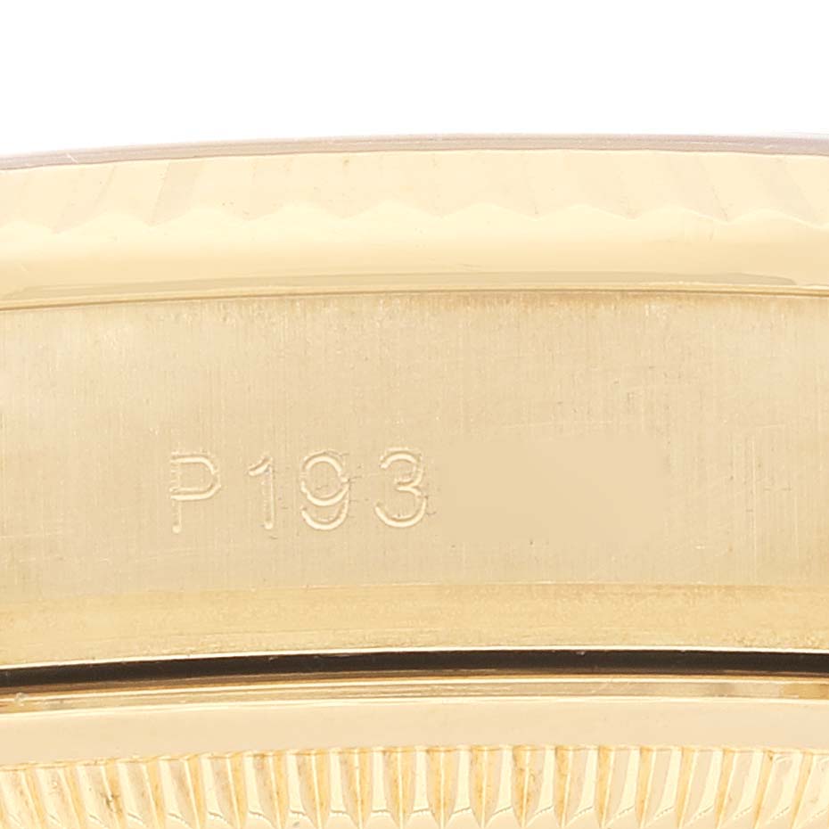 This close-up image showcases the bezel and case of a Rolex President 118338 Men
s Yellow Gold Champagne Dial 118338 Men
s Yellow Gold Champagne Dial model, featuring its serial number.