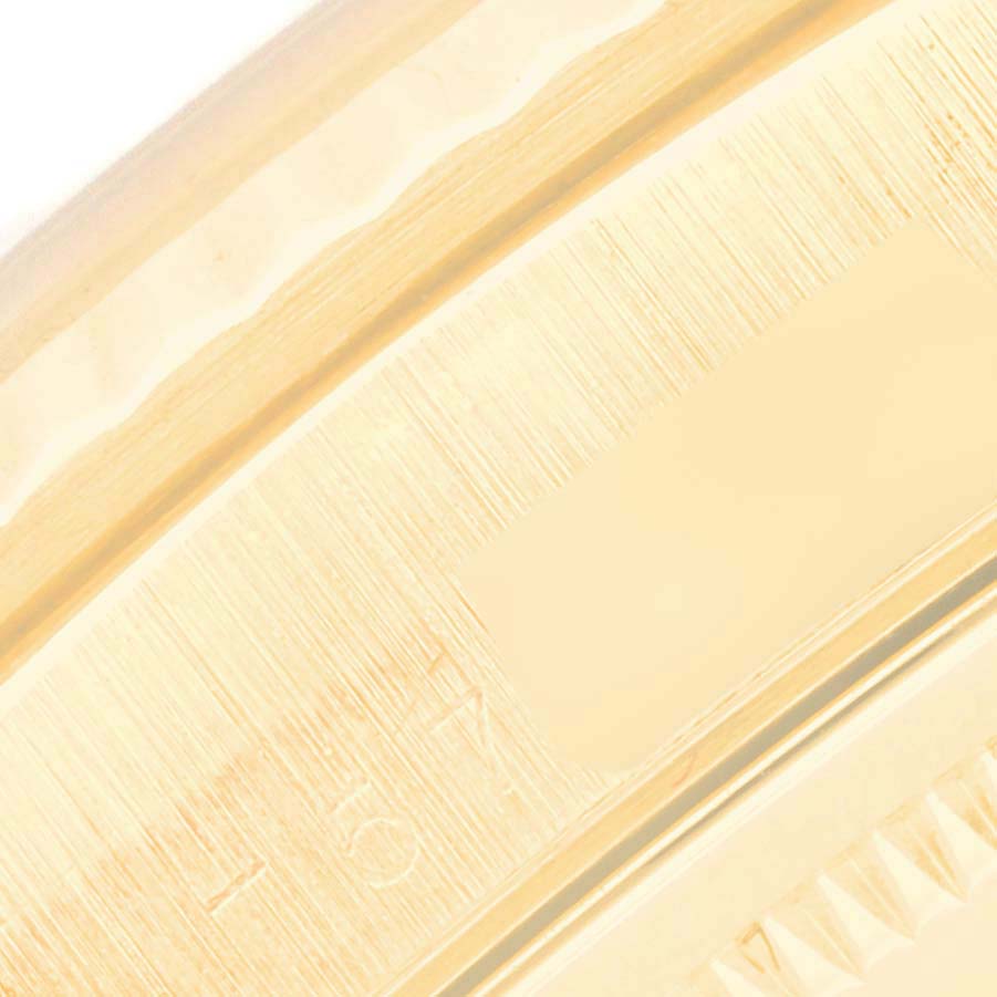 This image shows a close-up of the edge of the case for a Rolex President 18238 Men's Yellow Gold White Dial 18238 Men's Yellow Gold White Dial model watch, highlighting its detailing and texture.