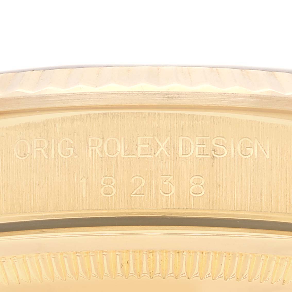 The image shows a close-up of the case side of a Rolex President 18238 Men's Yellow Gold Blue Dial 18238 Men's Yellow Gold Blue Dial model, displaying the model number and "ORIG. ROLEX DESIGN" engraving.