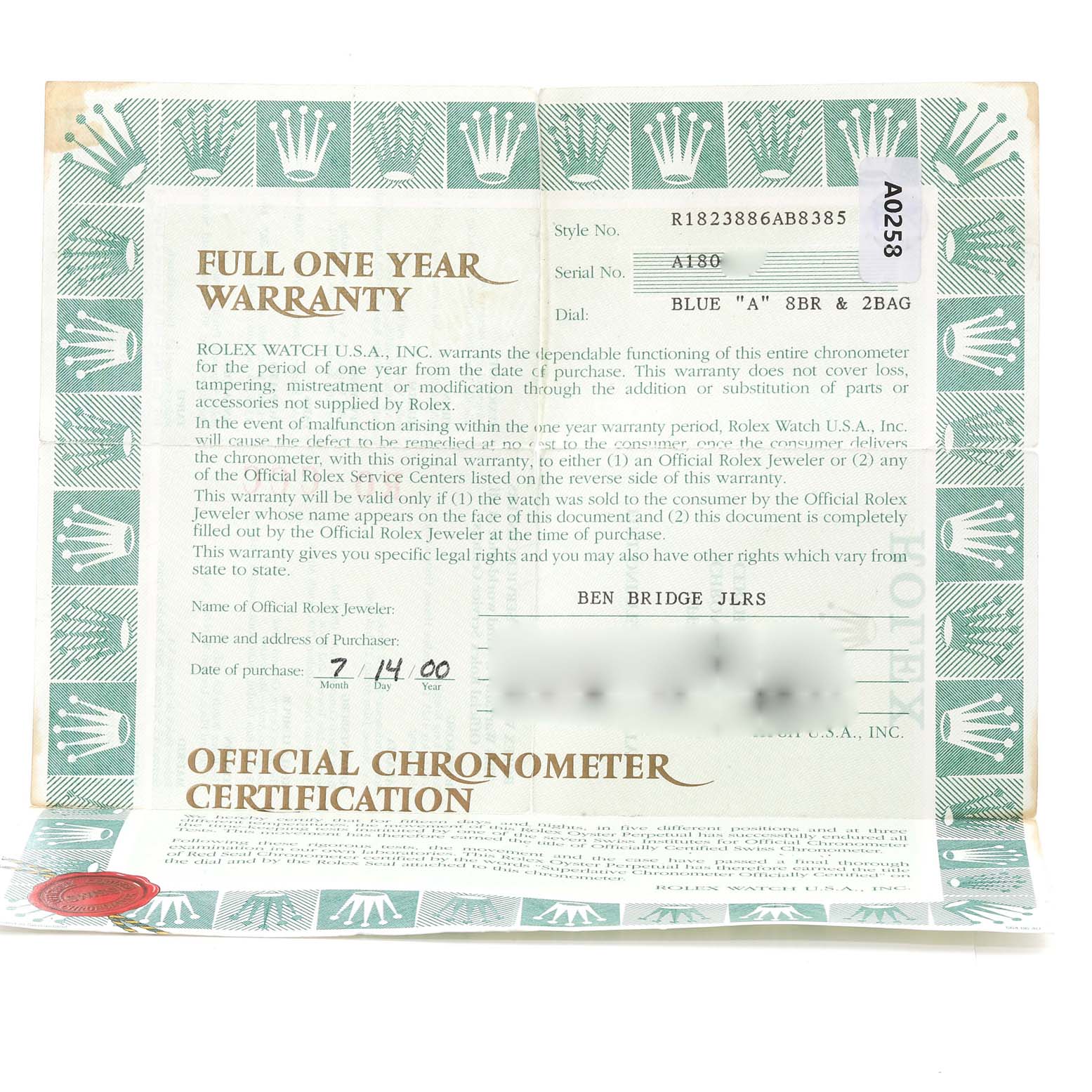 The photo shows a warranty certificate for a Rolex President 18238 Men's Yellow Gold Blue Dial 18238 Men's Yellow Gold Blue Dial model watch, featuring details like the style number, serial number, and purchase date.