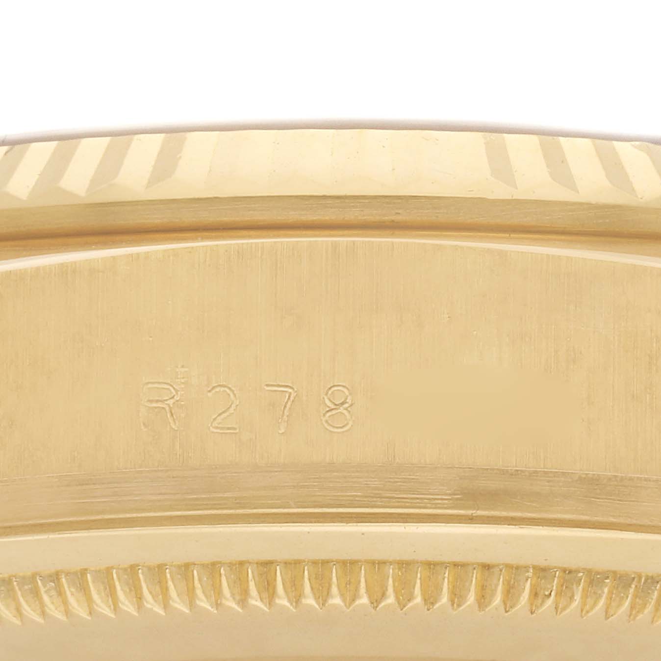 The image shows a close-up side view of the bezel edge, with serial engraving on a Rolex President 18038 Men
s Yellow Gold Champagne Dial 18038 Men
s Yellow Gold Champagne Dial model.