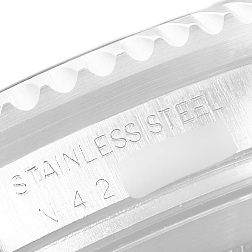 This image shows a close-up of the stainless steel case edge of a Rolex Sea-Dweller 16600 Men
s Stainless Steel Black Dial 16600 Men
s Stainless Steel Black Dial watch.