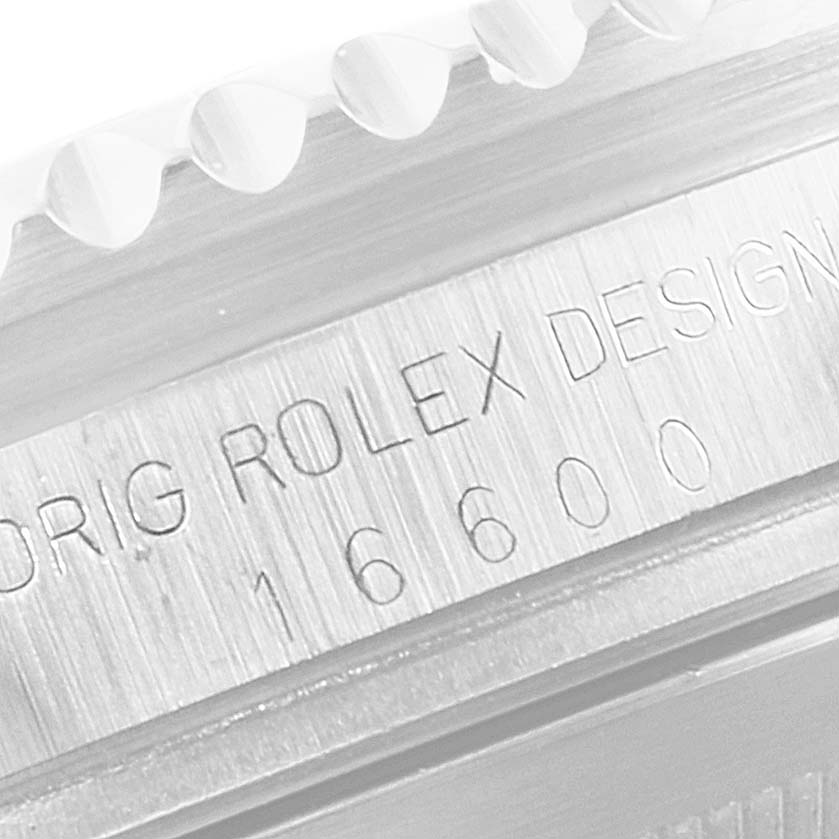 The image shows a close-up of the Rolex Sea-Dweller 16600 Men
s Stainless Steel Black Dial 16600 Men
s Stainless Steel Black Dial model 16600 reference number engraving on the watch case.
