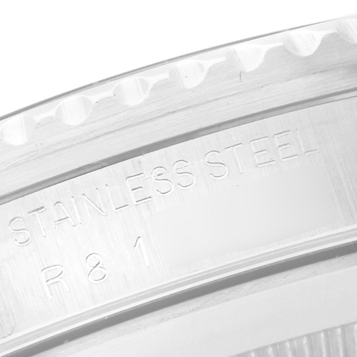 The image shows a close-up of the case back edge of a Rolex Submariner 168000 Men
s Stainless Steel Black Dial 168000 Men
s Stainless Steel Black Dial, highlighting the stainless steel engraving.