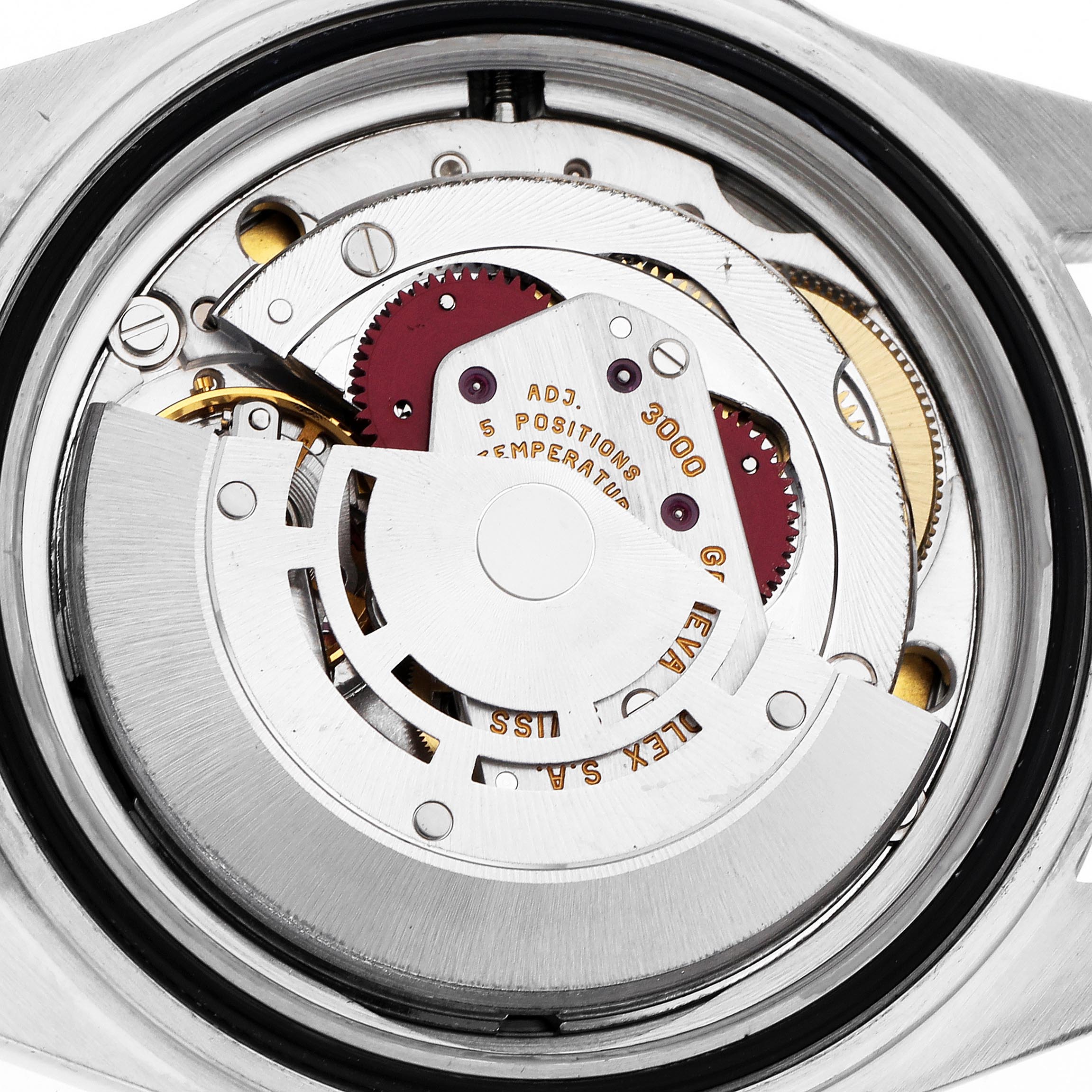 The image shows the movement of a Rolex Submariner 14060 Men
s Stainless Steel Black Dial 14060 Men
s Stainless Steel Black Dial watch from a top-down angle, displaying gears and inscriptions.