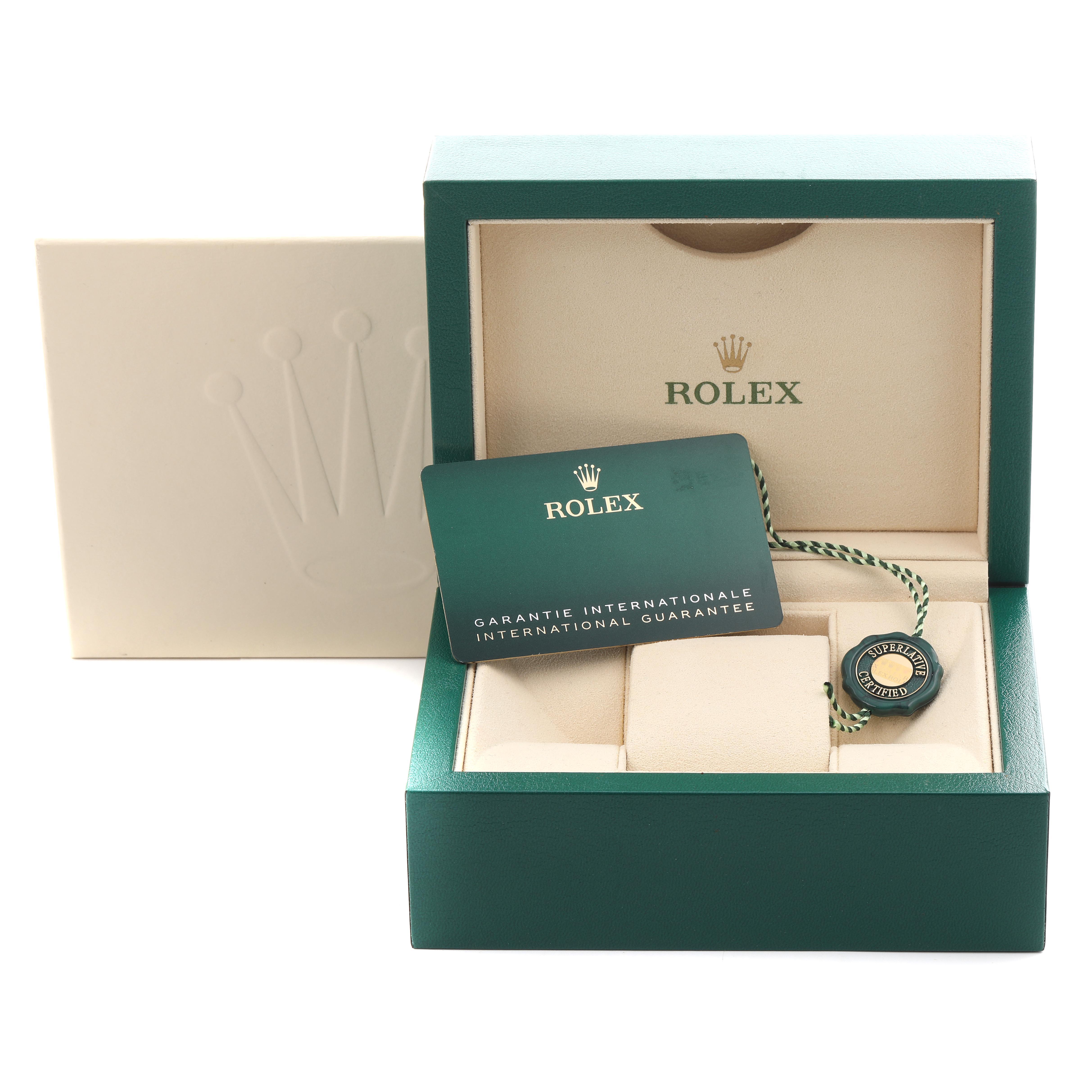 The image shows a Rolex Submariner 124060 Men
s Stainless Steel Black Dial 124060 Men
s Stainless Steel Black Dial watch box open, featuring the guarantee card and a tag inside.