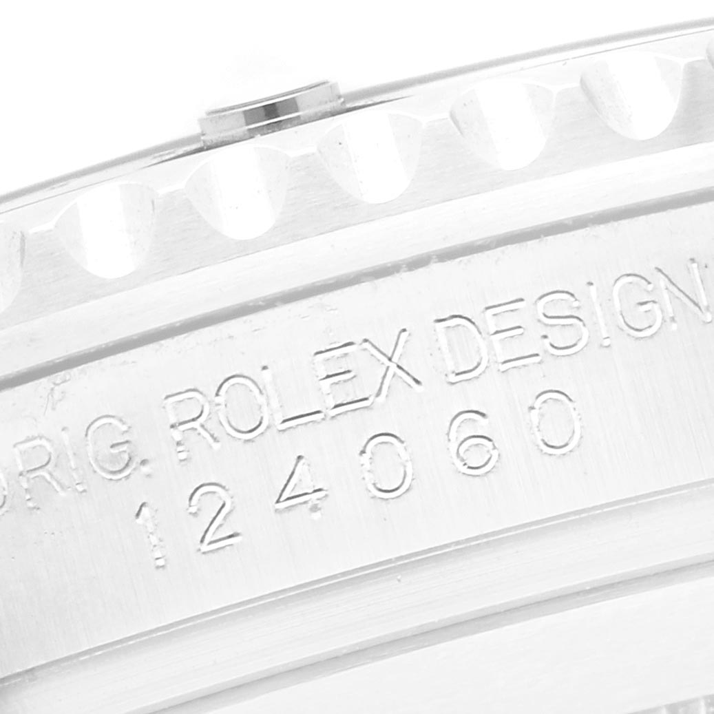 The image shows the side engraving of the Rolex Submariner 124060 Men
s Stainless Steel Black Dial 124060 Men
s Stainless Steel Black Dial model 124060, highlighting "ORIG. ROLEX DESIGN."