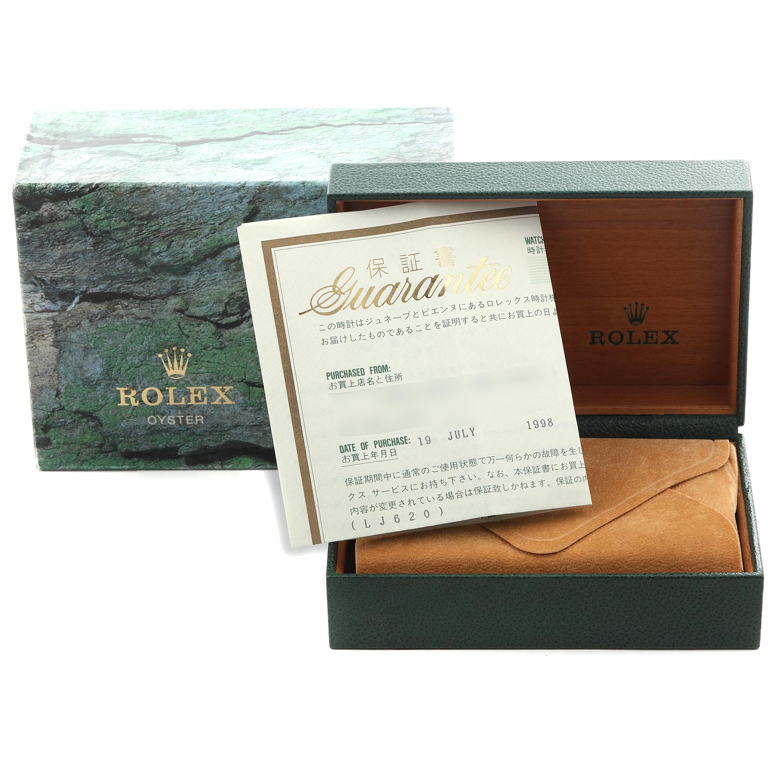 The image shows a Rolex Submariner 16613 Men
s Steel and Gold (two tone) Champagne Dial 16613 Men
s Steel and Gold (two tone) Champagne Dial box and guarantee card, with the interior partially open, revealing a protective pouch.