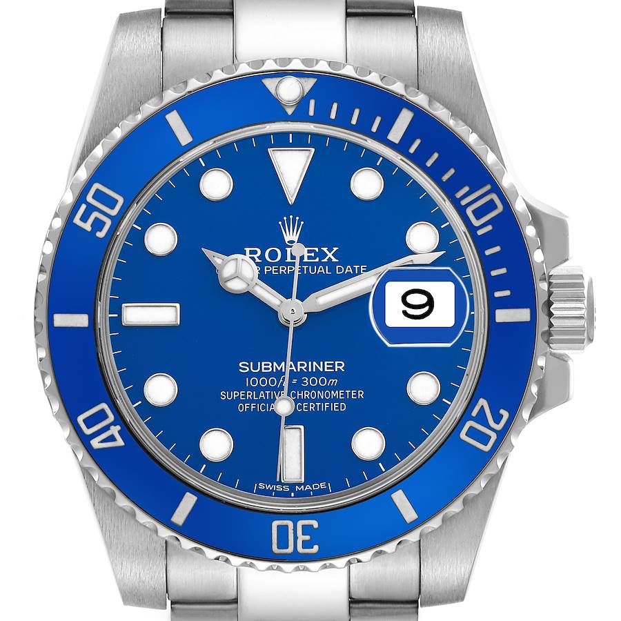 The Rolex Submariner watch is shown from a front angle, displaying the blue dial, bezel, date window, and part of the bracelet.