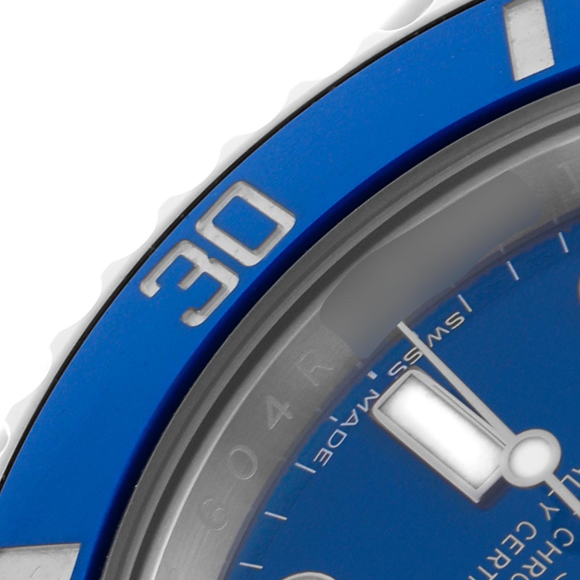 This image shows a close-up of the bezel and part of the dial of the Rolex Submariner 116619 Men
s White Gold Blue Dial 116619 Men
s White Gold Blue Dial, highlighting the "30" marker and part of the minute hand.