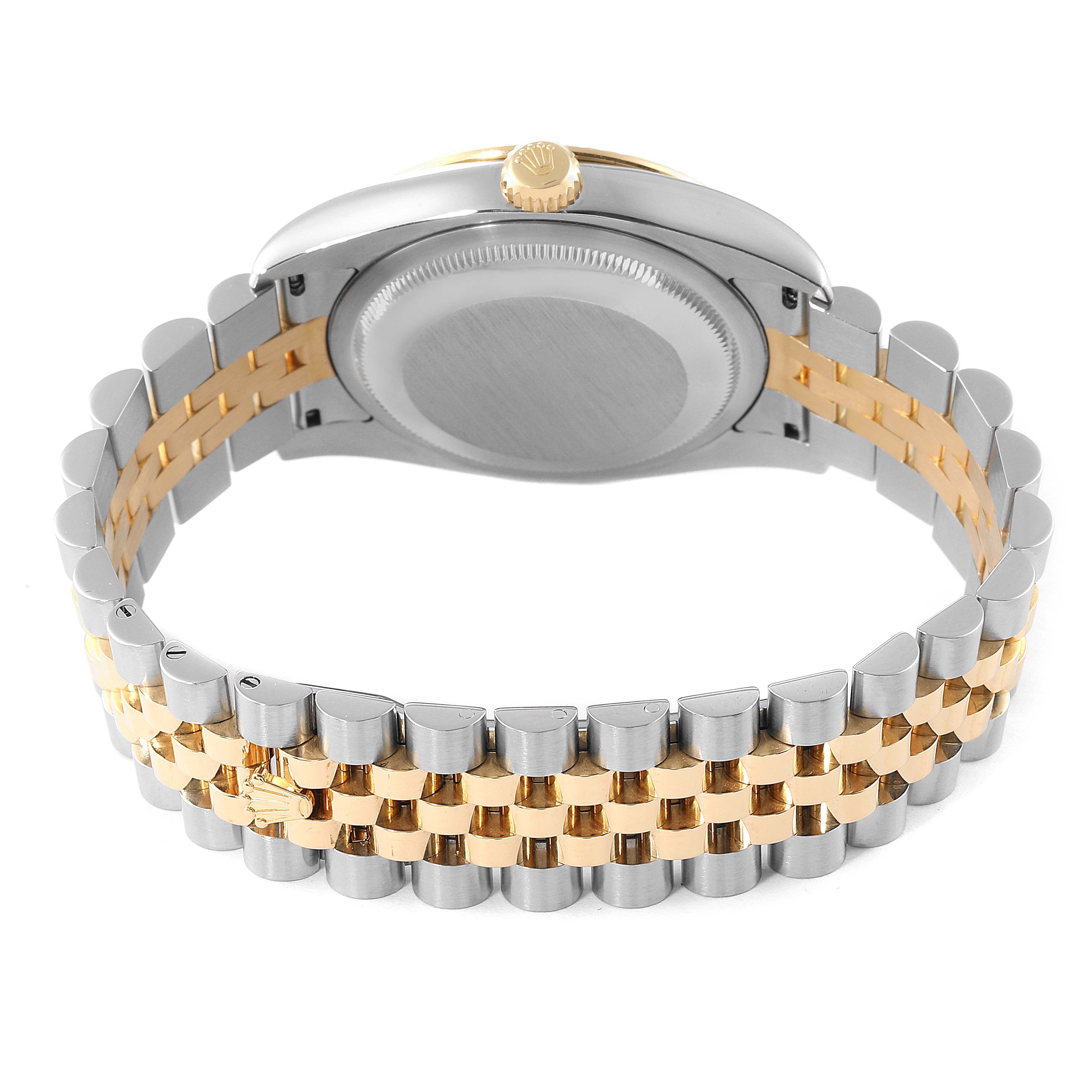 The image shows the back side and part of the strap of a Rolex Turn-o-Graph 116263 Men
s Steel and Gold (two tone) Grey Dial 116263 Men
s Steel and Gold (two tone) Grey Dial watch, highlighting the caseback and bracelet.