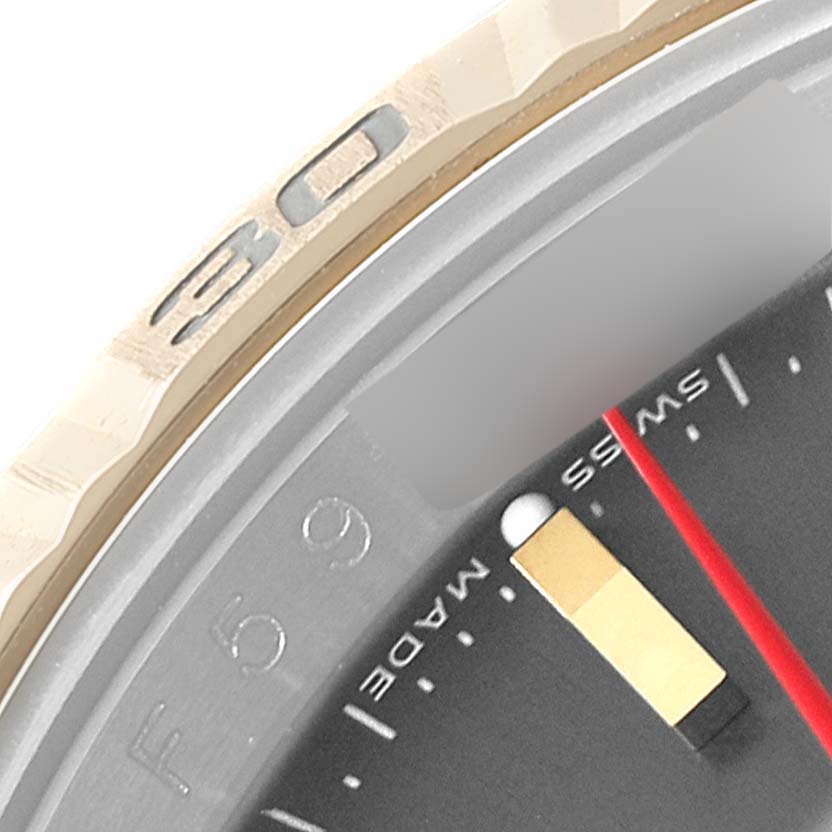 The image shows a close-up of the bezel and part of the dial of a Rolex Turn-o-Graph 116263 Men
s Steel and Gold (two tone) Grey Dial 116263 Men
s Steel and Gold (two tone) Grey Dial watch.