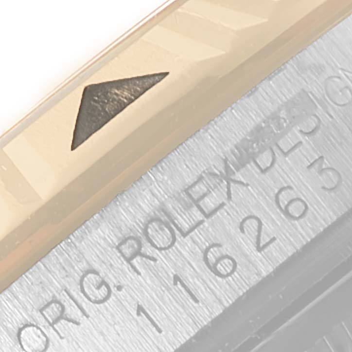 This image shows a close-up of the bezel and part of the case of a Rolex Turn-o-Graph 116263 Men
s Steel and Gold (two tone) Grey Dial 116263 Men
s Steel and Gold (two tone) Grey Dial watch.