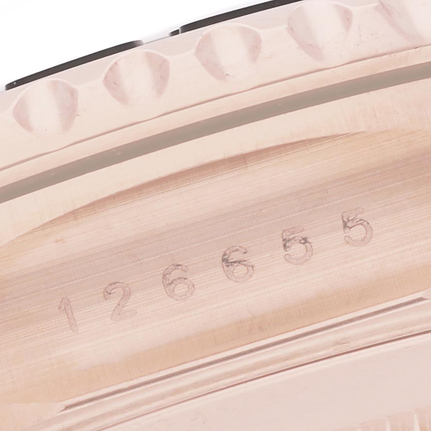 The image shows a close-up of the side of the Rolex Yacht-Master 126655 Men
s Rose Gold Black Dial 126655 Men
s Rose Gold Black Dial, highlighting the bezel and engraved numbers.
