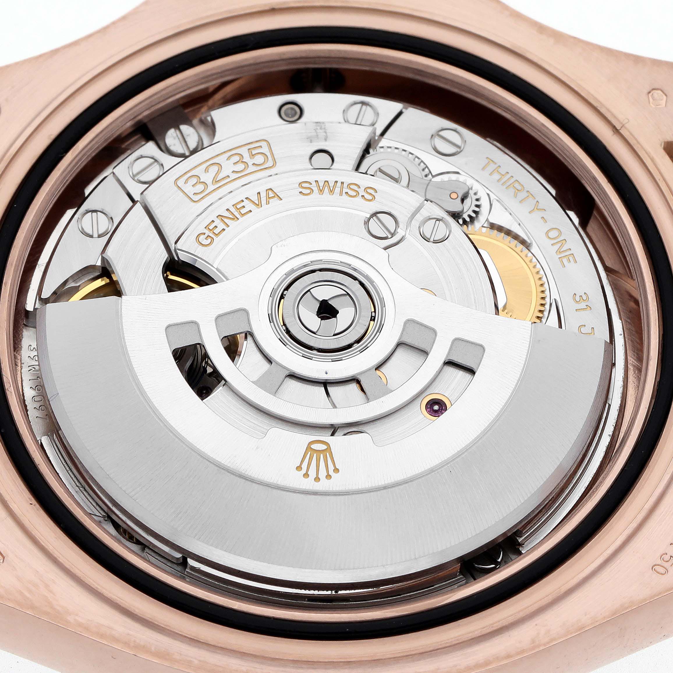 The image shows the movement of a Rolex Yacht-Master 126655 Men
s Rose Gold Black Dial 126655 Men
s Rose Gold Black Dial watch from the back, highlighting the rotor and mechanism details.