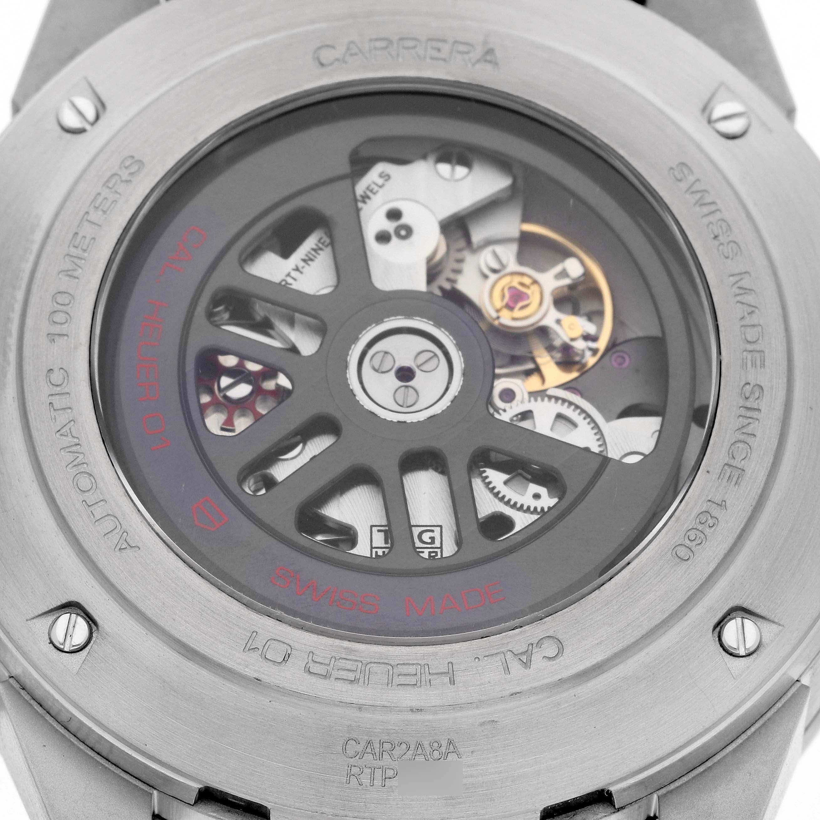 This image shows the back case of a Tag Heuer Carrera CAR2A8A.BF0707 Men's Titanium Grey Dial CAR2A8A.BF0707 Men's Titanium Grey Dial model watch, highlighting its inner mechanics and automatic movement.