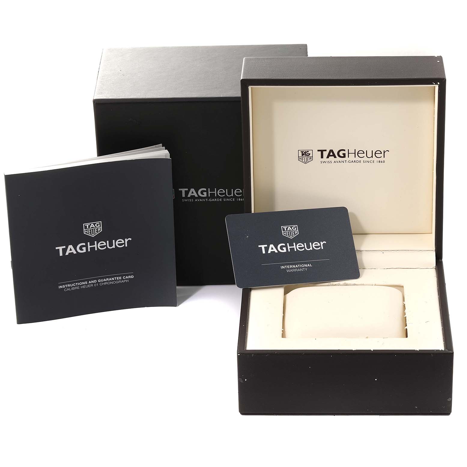 The image shows the packaging, manual, and warranty card for a Tag Heuer Carrera CAR2A8A.BF0707 Men's Titanium Grey Dial CAR2A8A.BF0707 Men's Titanium Grey Dial watch, viewed from a front angle.