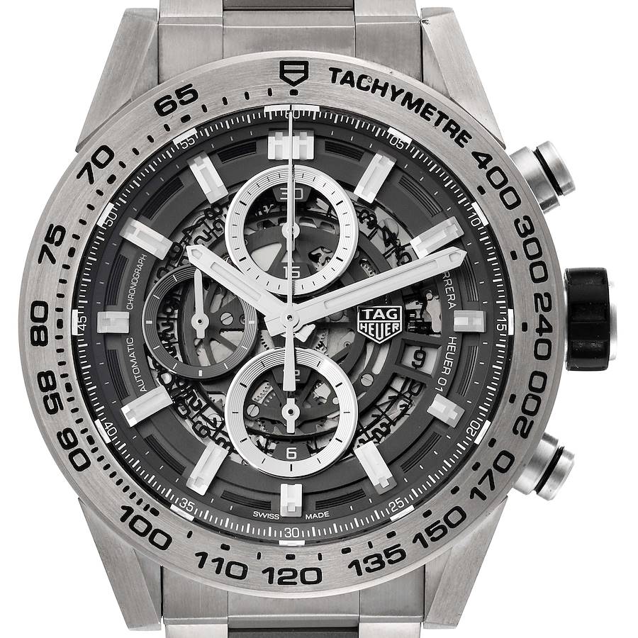 The image shows a frontal view of the Tag Heuer Carrera watch, highlighting the dial, bezel, and tachymeter scale.