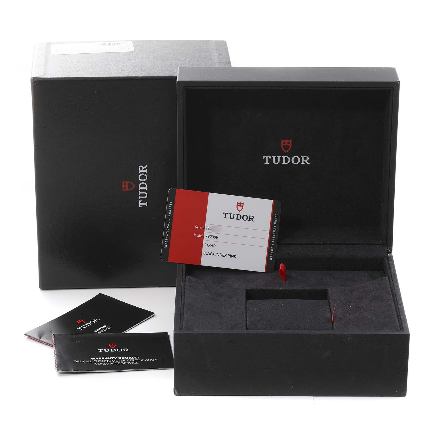 This image shows the packaging, warranty booklet, and authentication card for a Tudor Heritage Black Bay M79230R-0010 Men's Stainless Steel Black Dial M79230R-0010 Men's Stainless Steel Black Dial watch.