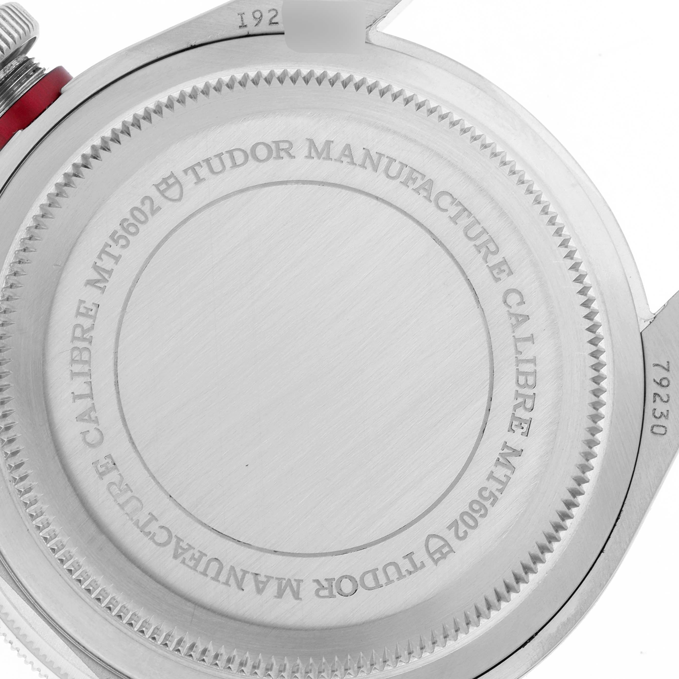 This image shows the back case of the Tudor Heritage Black Bay M79230R-0010 Men's Stainless Steel Black Dial M79230R-0010 Men's Stainless Steel Black Dial watch, displaying the Tudor branding and caliber information.