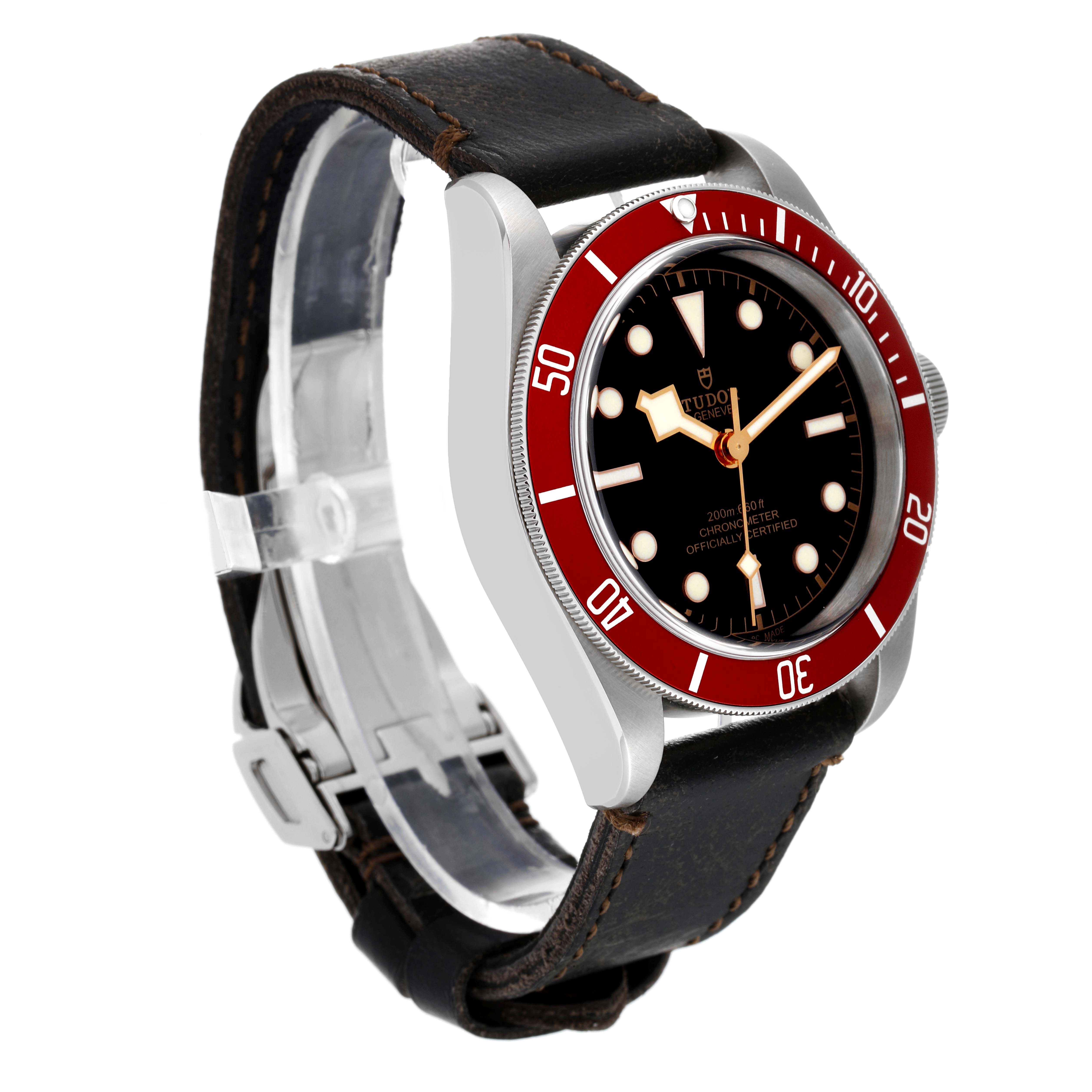 The Tudor Heritage Black Bay M79230R-0010 Men's Stainless Steel Black Dial M79230R-0010 Men's Stainless Steel Black Dial watch is shown at a three-quarter angle, highlighting its red bezel, black dial, and brown leather strap.