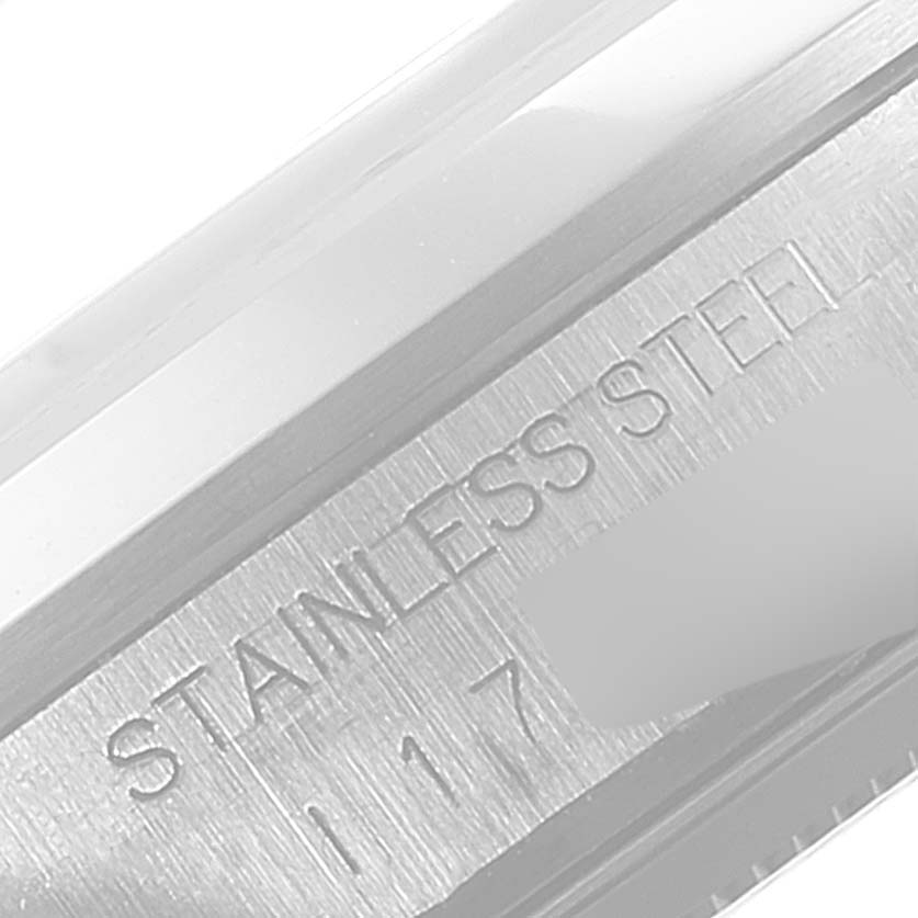 This is a close-up of the side edge of the stainless steel case of a Tudor Prince 76200 Men's Stainless Steel Black Dial 76200 Men's Stainless Steel Black Dial watch.