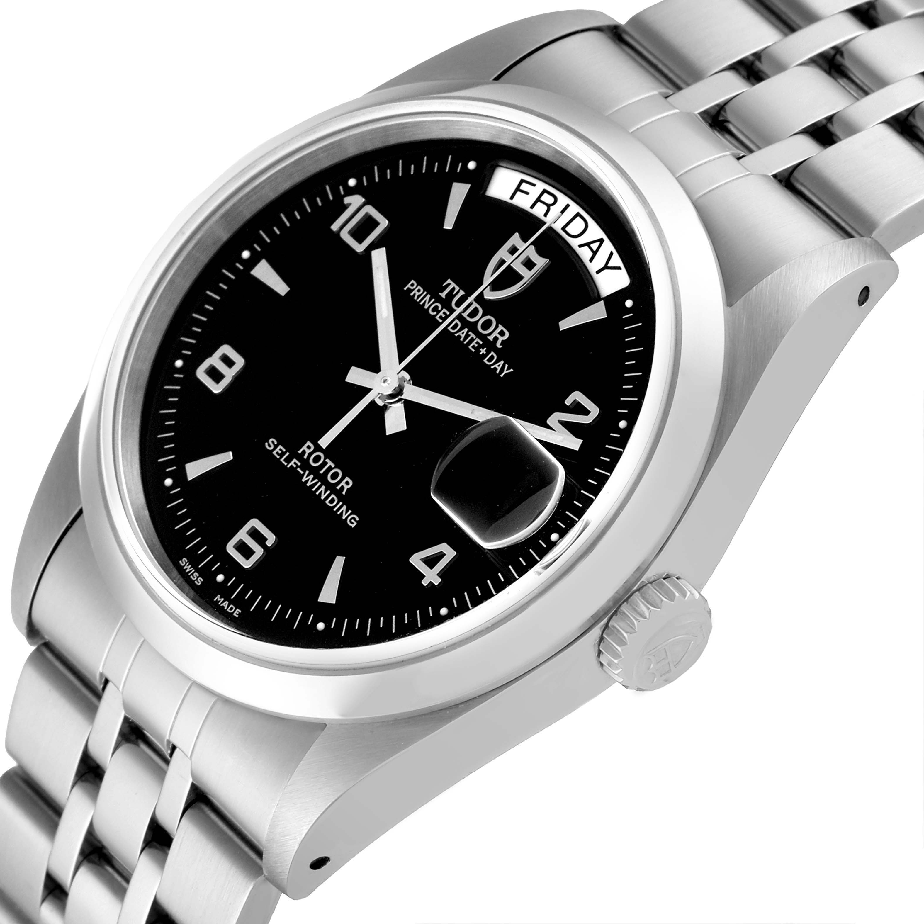 The image shows a close-up, angled view of a Tudor Prince 76200 Men's Stainless Steel Black Dial 76200 Men's Stainless Steel Black Dial watch, featuring the dial, day-date display, and part of the bracelet.