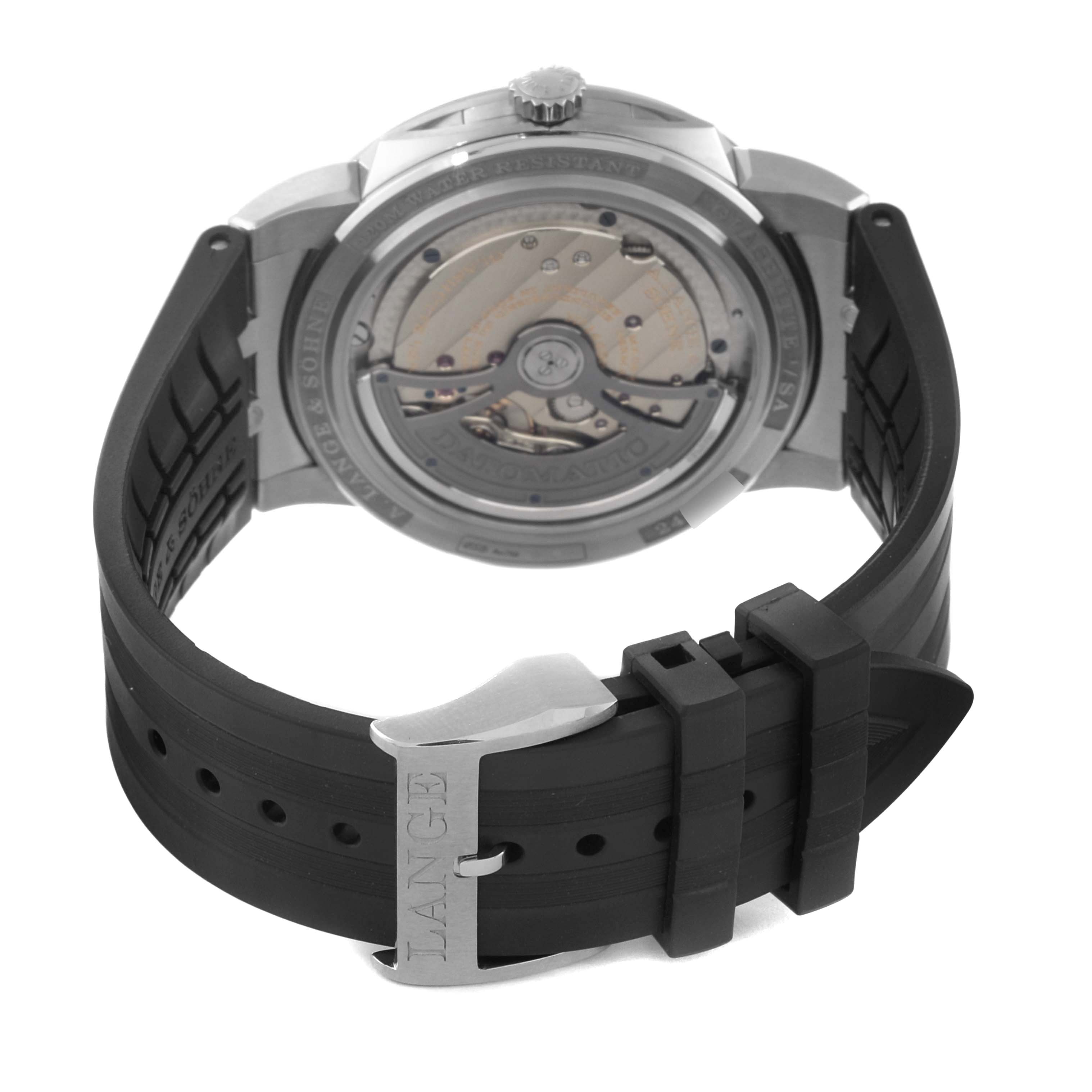 The image shows the back view of the A. Lange & Sohne Odysseus 363.068 Men's White Gold Grey Dial watch, highlighting the movement and black rubber strap with a buckle.