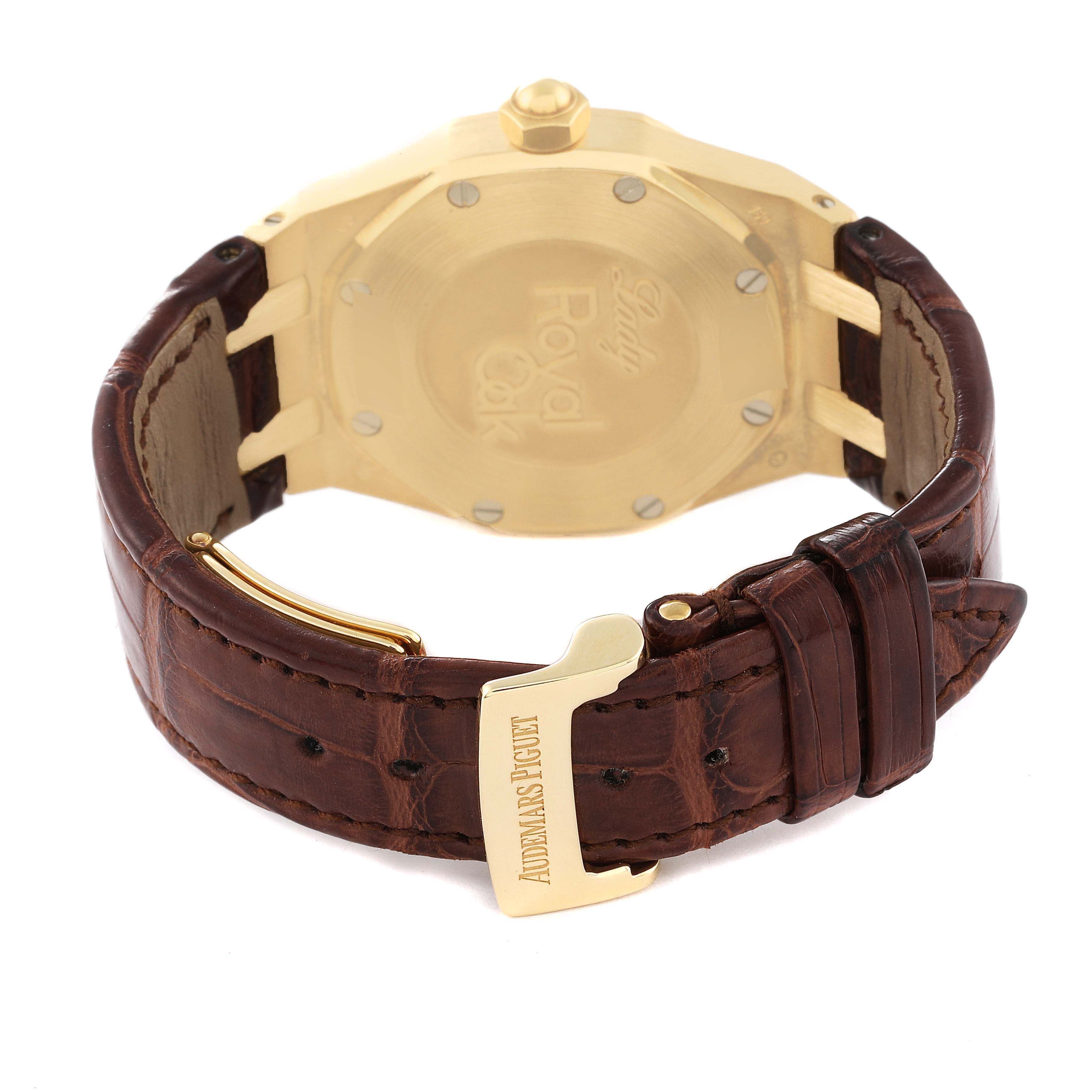 The image shows the back case and leather strap with the clasp of a Royal Oak model watch by Audemars Piguet.