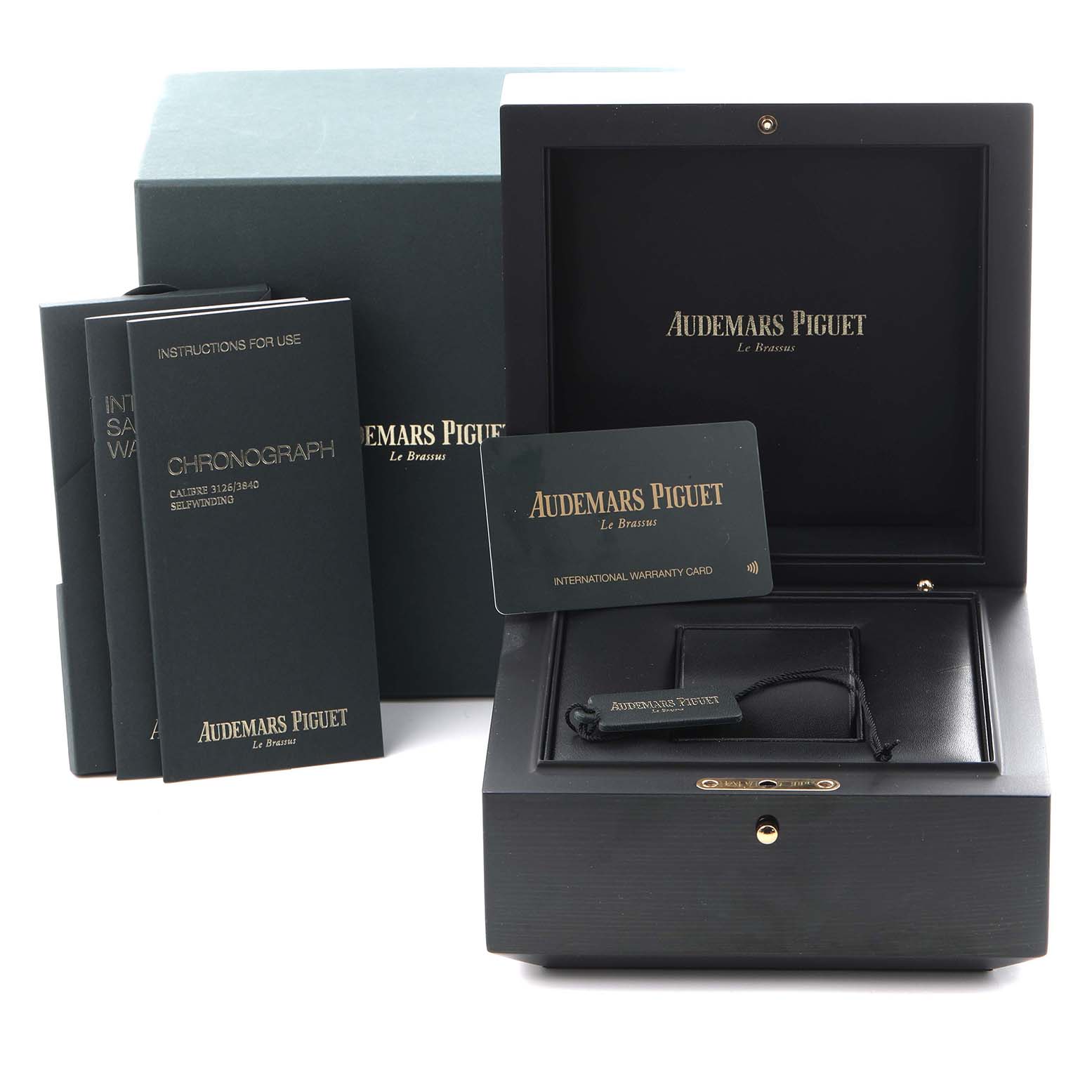 The image shows the box, warranty card, and manuals for the Audemars Piguet Royal Oak Offshore 26405NR.OO.A002CA.01.A Men
s Ceramic Grey Dial 26405NR.OO.A002CA.01.A Men
s Ceramic Grey Dial model.