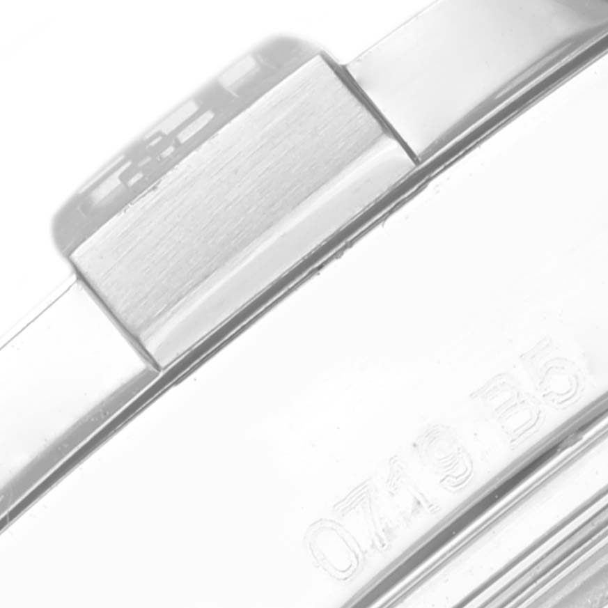 This close-up image shows part of the bracelet clasp of a Breitling Avenger A32390 Men's Stainless Steel Mother of Pearl Dial A32390 Men's Stainless Steel Mother of Pearl Dial watch, including a serial number.