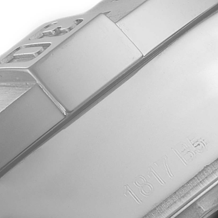 This close-up image shows part of the bezel and etched markings of a Breitling Colt A17388 Men's Stainless Steel Blue Dial A17388 Men's Stainless Steel Blue Dial watch.