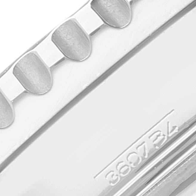 This image shows a close-up of the bezel and part of the case back of a Breitling Navitimer A23322 Men
s Stainless Steel Black Dial A23322 Men
s Stainless Steel Black Dial watch, displaying the model number "360734."