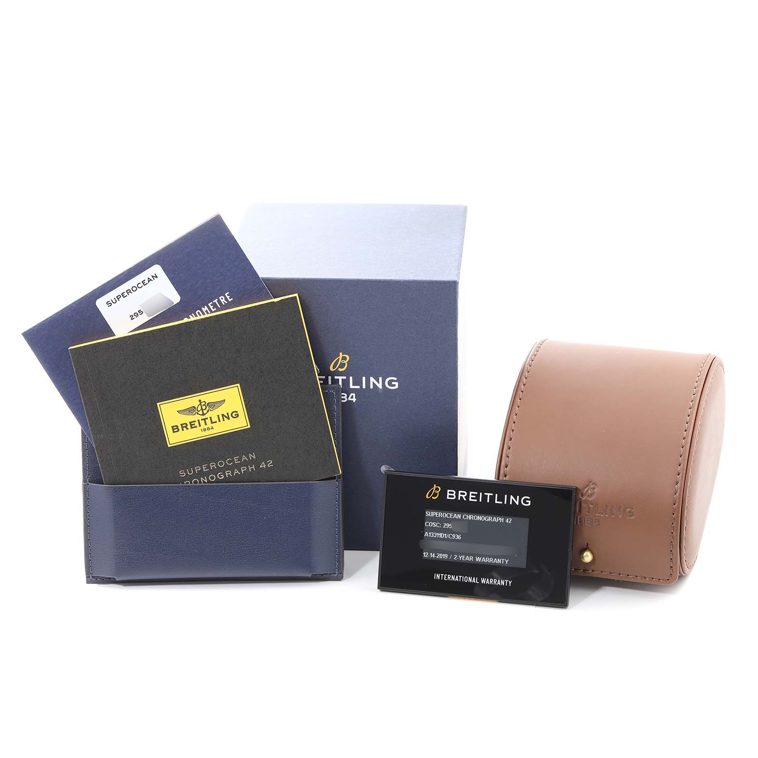 The image shows accessories for the Breitling Superocean A13311 Men's Stainless Steel Blue Dial A13311 Men's Stainless Steel Blue Dial model, including a blue box, warranty card, manuals, and a brown leather carrying case.