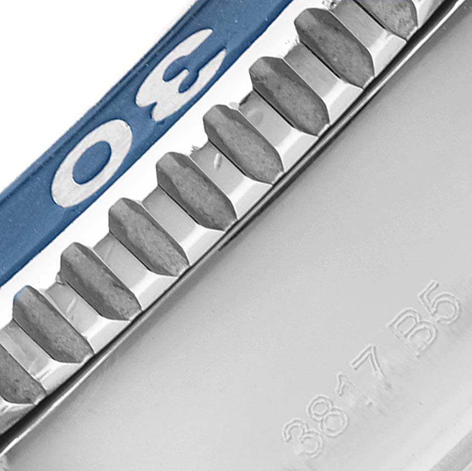 The image shows a close-up of the engraved side bezel and blue uni-directional rotating bezel of the Breitling Superocean A13311 Men's Stainless Steel Blue Dial A13311 Men's Stainless Steel Blue Dial model.