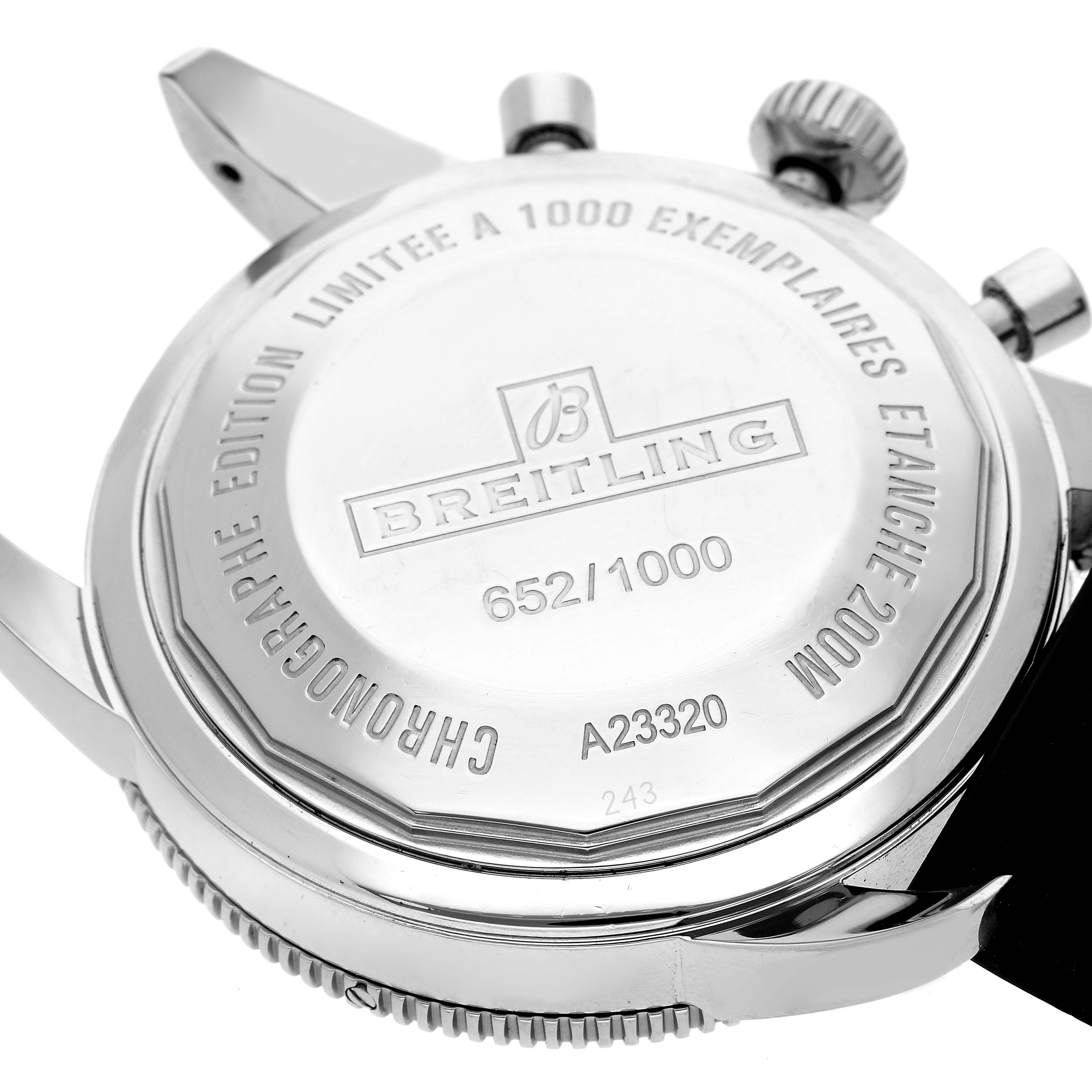 The image shows the back of a Breitling Superocean A23320 Men
s Stainless Steel Silver Dial A23320 Men
s Stainless Steel Silver Dial watch, highlighting its case back, crown, and limited edition engraving.