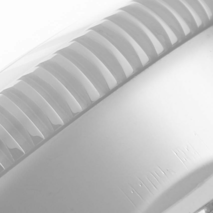 The image shows a close-up view of the bezel from a Breitling Superocean A17320 Men's Stainless Steel Blue Dial A17320 Men's Stainless Steel Blue Dial watch.