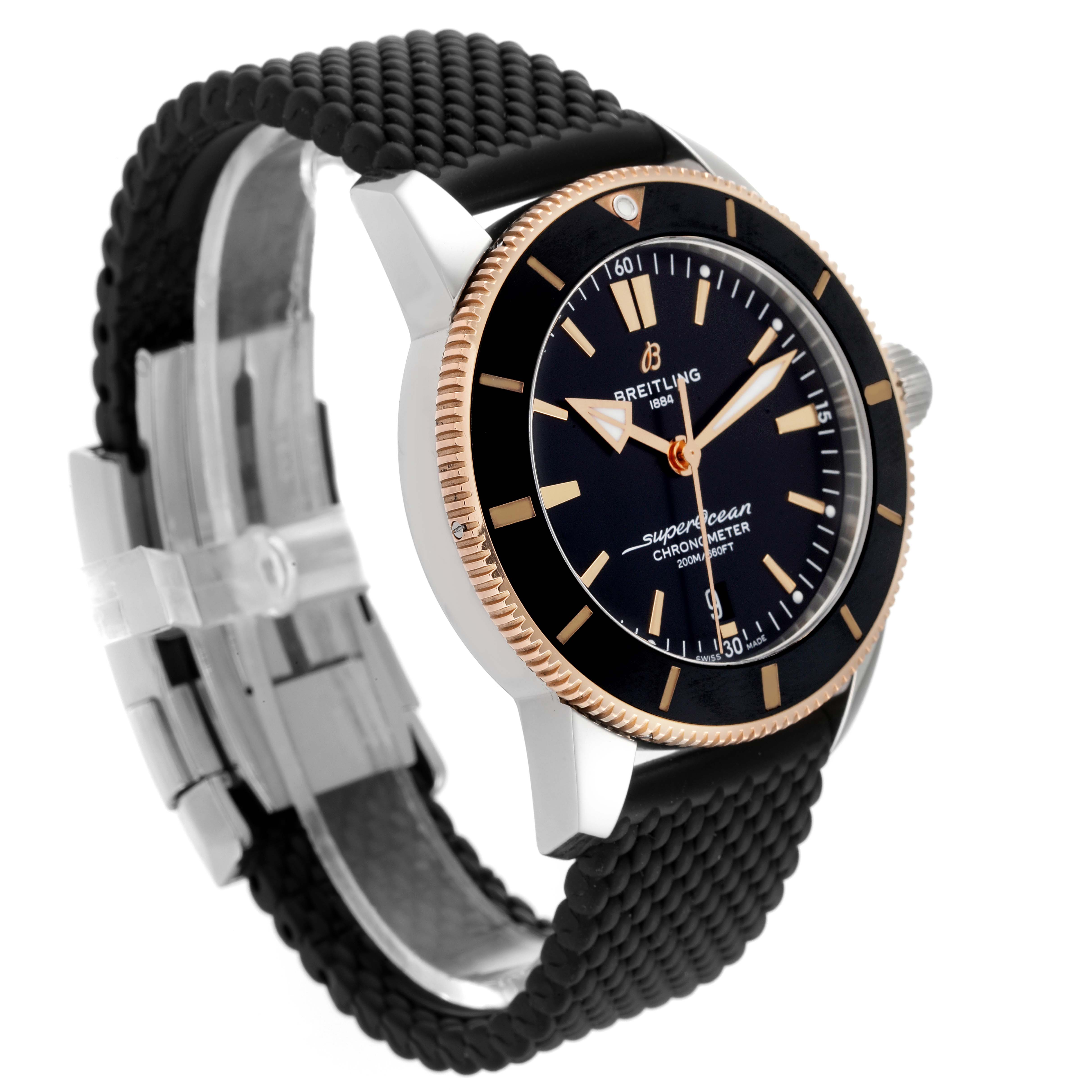 The Breitling Superocean UB2030121B1A1 Men's Steel and Gold (two tone) Black Dial UB2030121B1A1 Men's Steel and Gold (two tone) Black Dial watch is shown at a three-quarter angle, highlighting the dial, bezel, case, and textured strap.