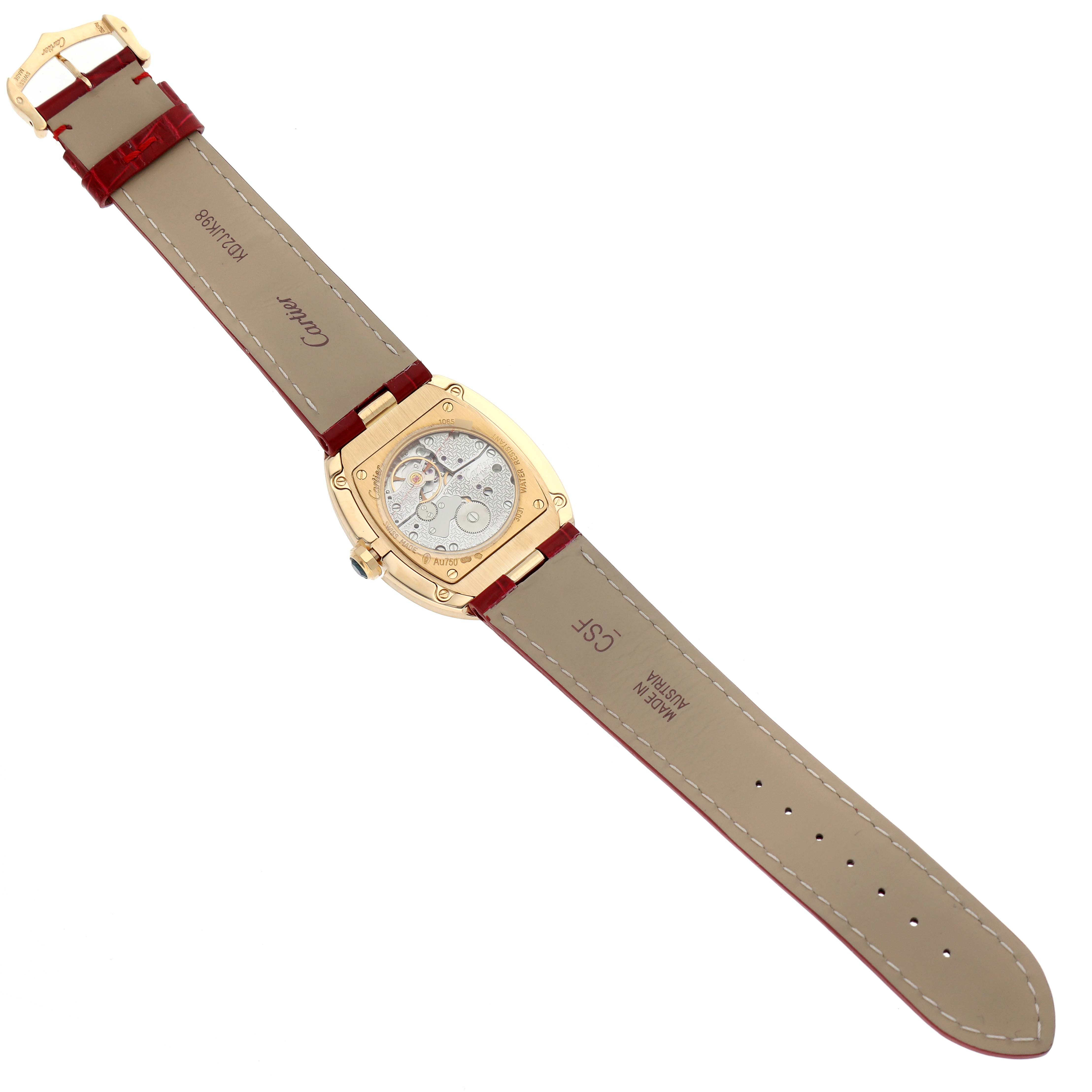 This image shows the back view of a Cartier Baignoire W8000013 Women's Yellow Gold Silver Dial W8000013 Women's Yellow Gold Silver Dial watch, highlighting the internal mechanism and the leather strap.