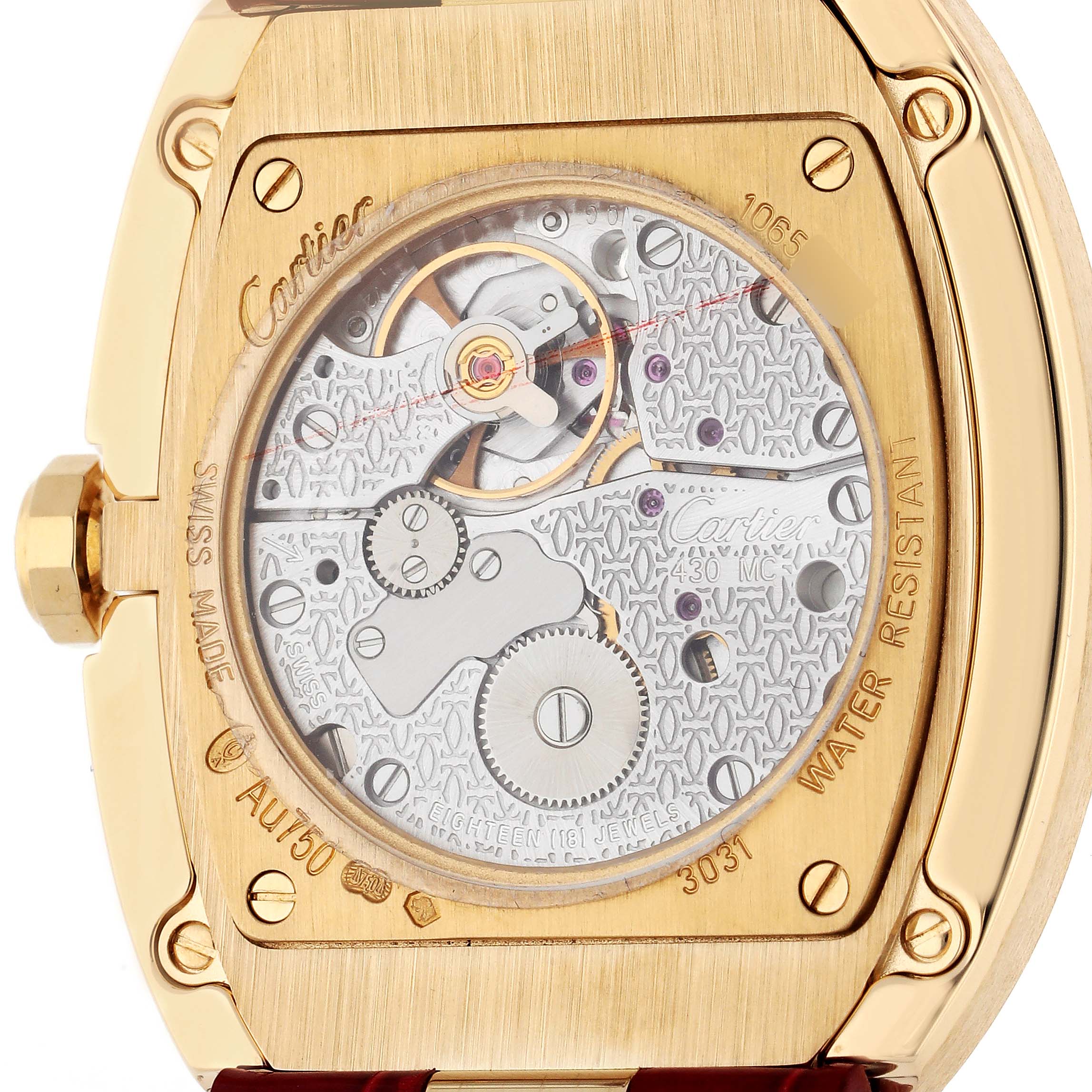 This is a close-up of the back of a Cartier Baignoire W8000013 Women's Yellow Gold Silver Dial W8000013 Women's Yellow Gold Silver Dial watch, showcasing its intricate movement and gold casing.