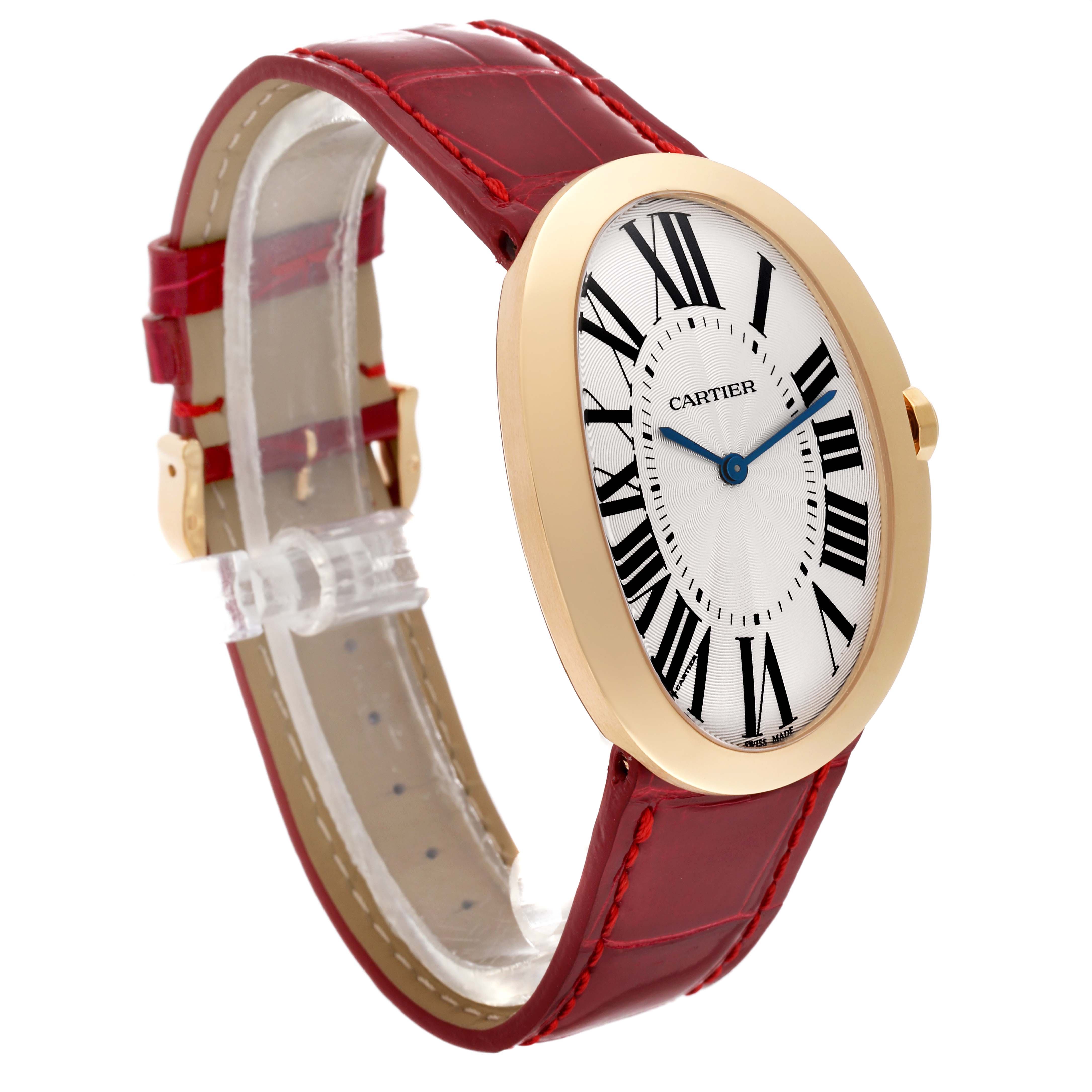 The Cartier Baignoire W8000013 Women's Yellow Gold Silver Dial W8000013 Women's Yellow Gold Silver Dial watch is shown from an angled side view, highlighting its oval face, Roman numerals, and red leather strap.