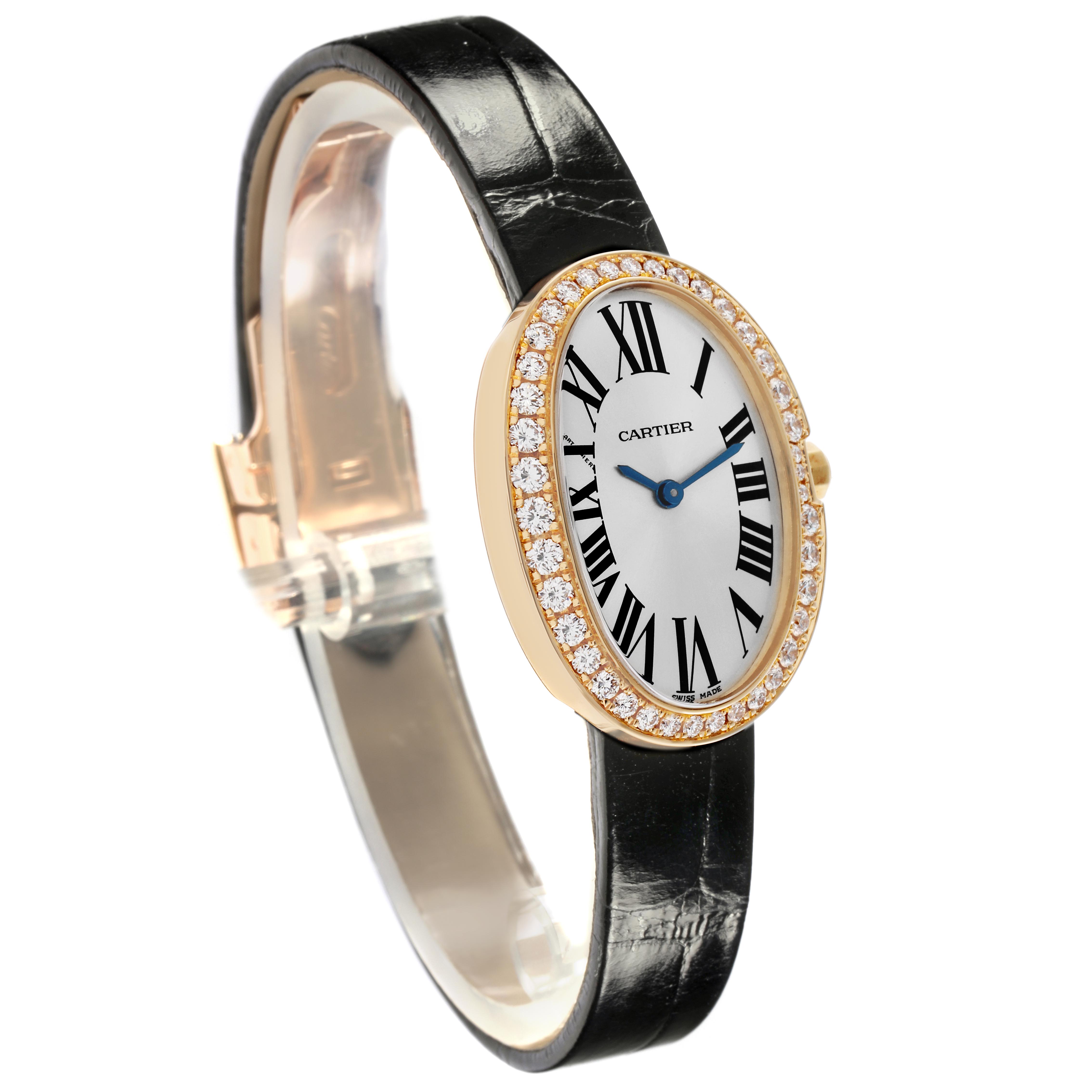 The Cartier Baignoire WB520020 Women
s Yellow Gold Silver Dial WB520020 Women
s Yellow Gold Silver Dial watch is shown at a side angle, featuring a diamond-set bezel, black leather strap, and Roman numeral dial.