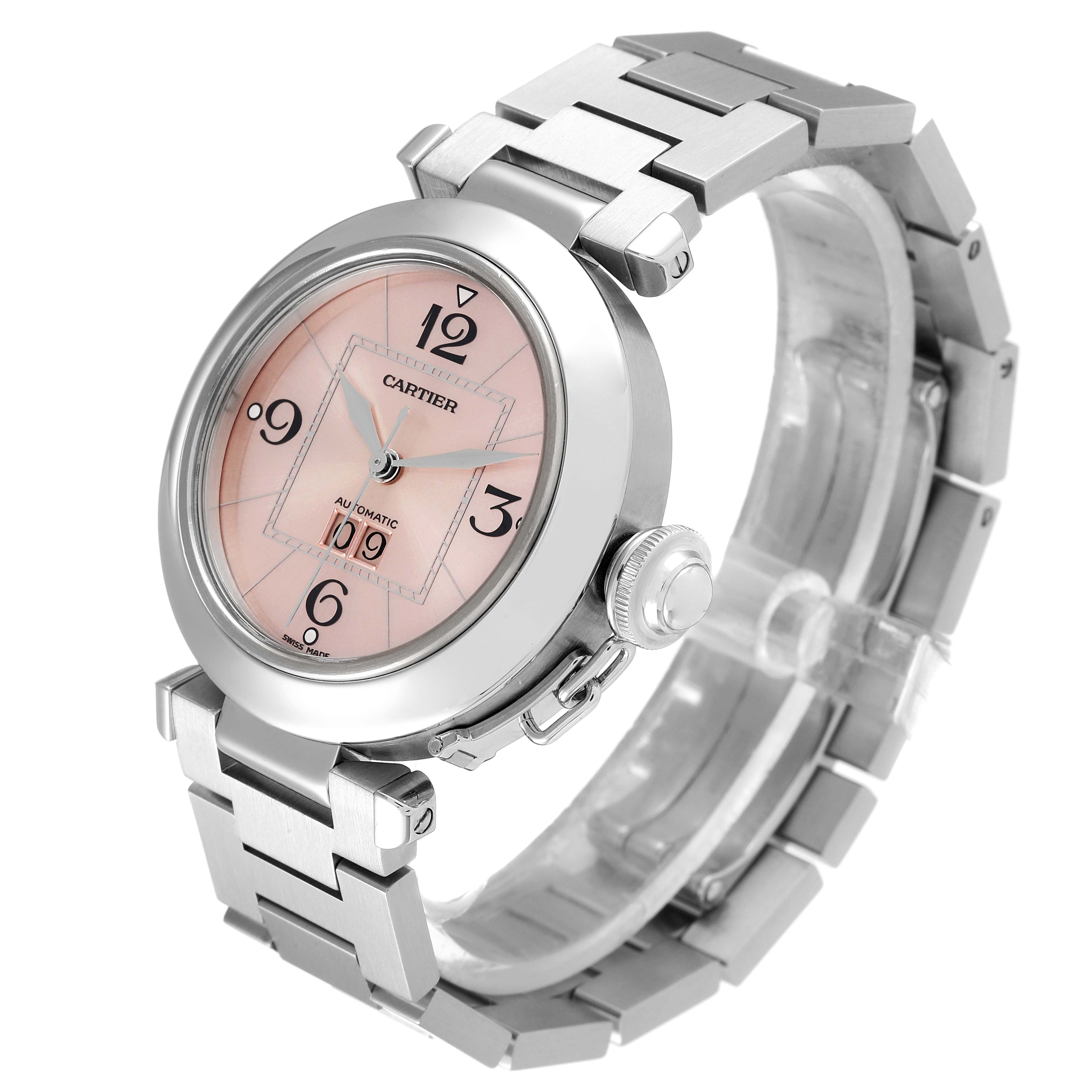 The image shows a frontal angle view of the Cartier Pasha W31058M7 Women's Stainless Steel Pink Dial W31058M7 Women's Stainless Steel Pink Dial model watch, highlighting the dial, bezel, crown, and bracelet.