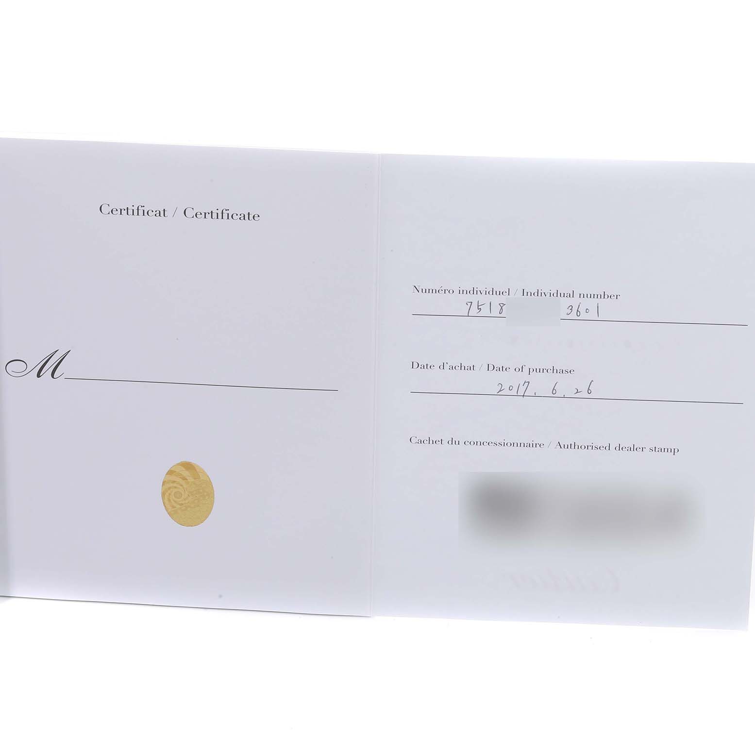 This image shows the certificate of authenticity for a Cartier Tank Solo W6701004 Women's Stainless Steel Silver Dial W6701004 Women's Stainless Steel Silver Dial model watch, including the individual number and date of purchase.