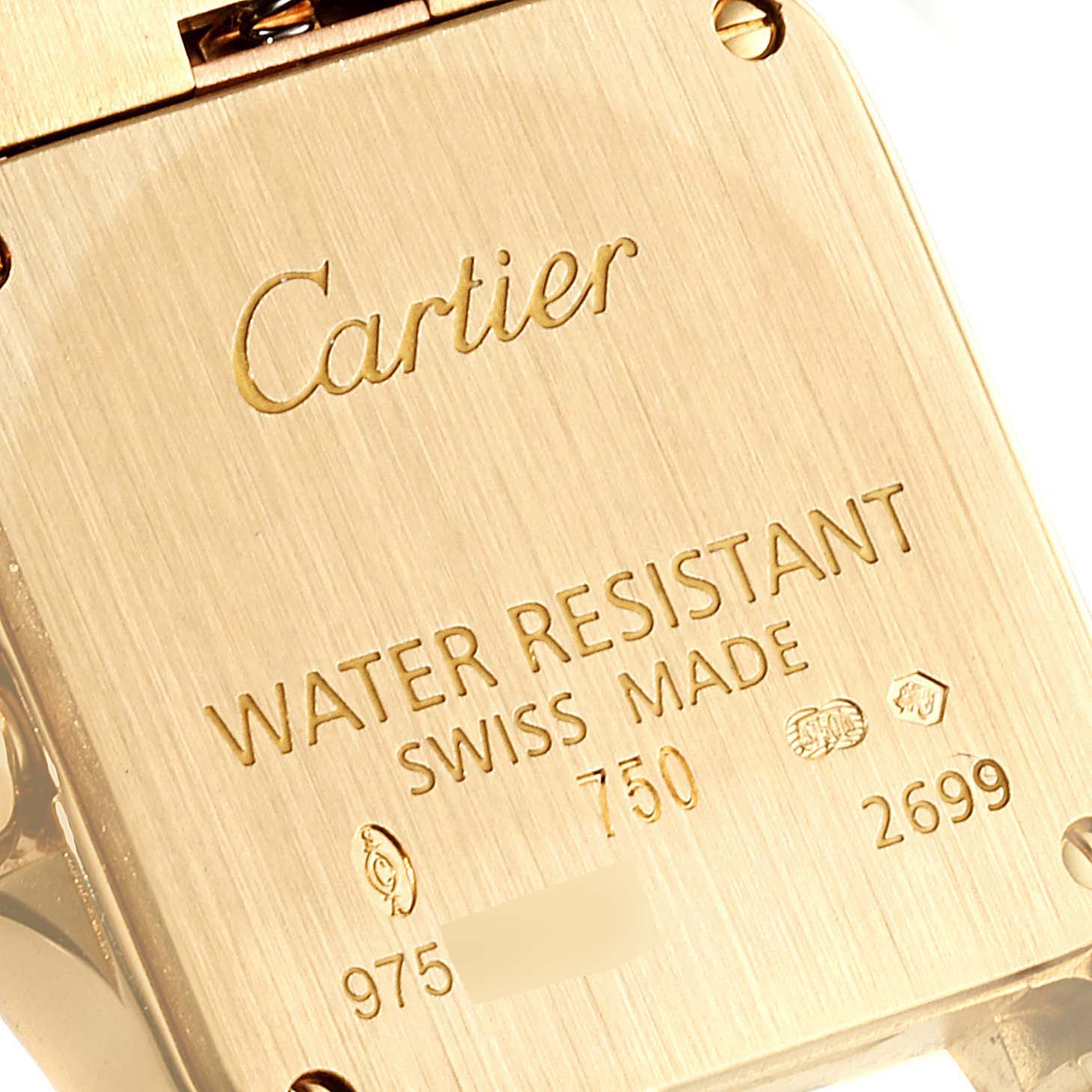 The image shows the back case of the Cartier Santos Demoiselle W25063X9 Women
s Yellow Gold Silver Dial W25063X9 Women
s Yellow Gold Silver Dial watch, highlighting its engraving and water resistance specifications.