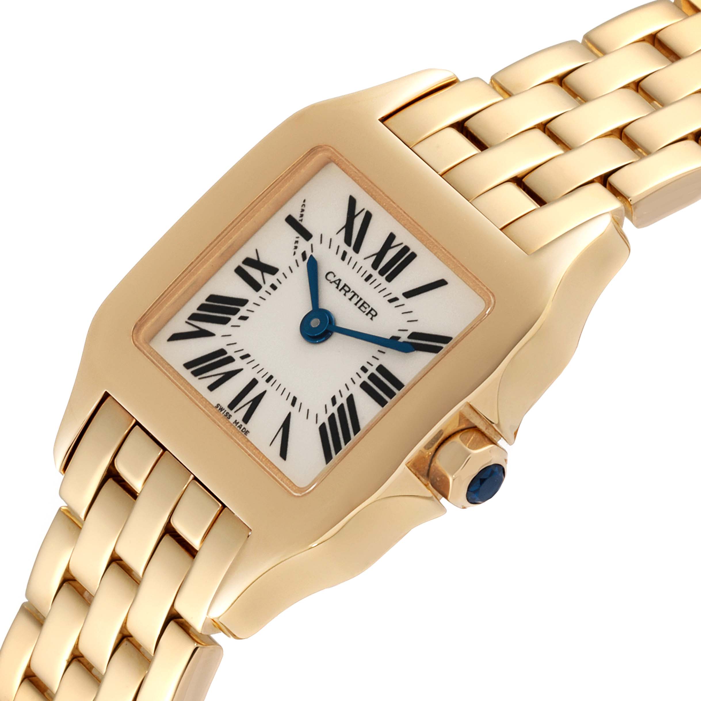 The image shows a Cartier Santos Demoiselle W25063X9 Women
s Yellow Gold Silver Dial W25063X9 Women
s Yellow Gold Silver Dial watch at an angle highlighting its square face, Roman numerals, and gold bracelet.