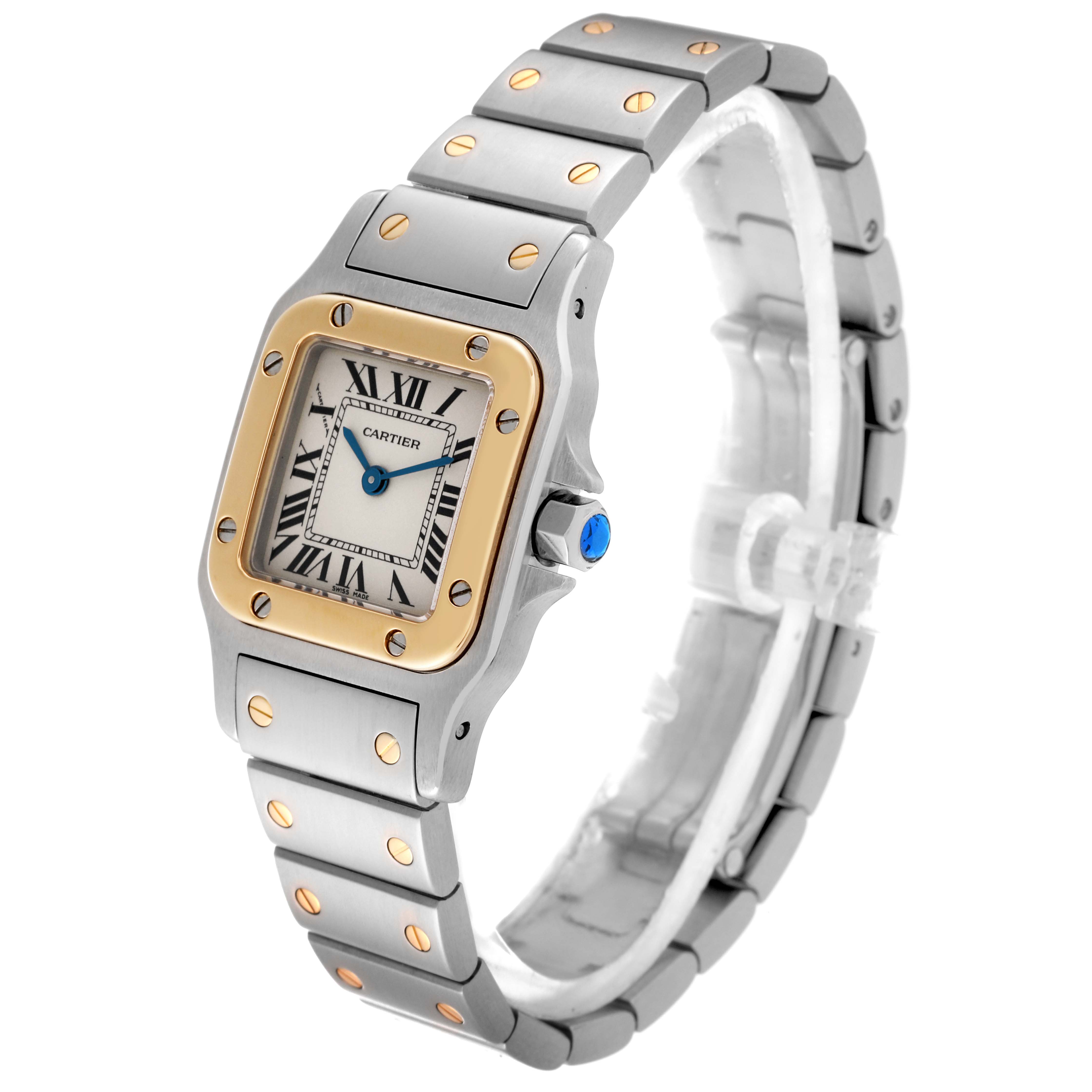 The image shows a Santos model by Cartier at a three-quarter angle, highlighting the watch face, bezel, crown, and bracelet.